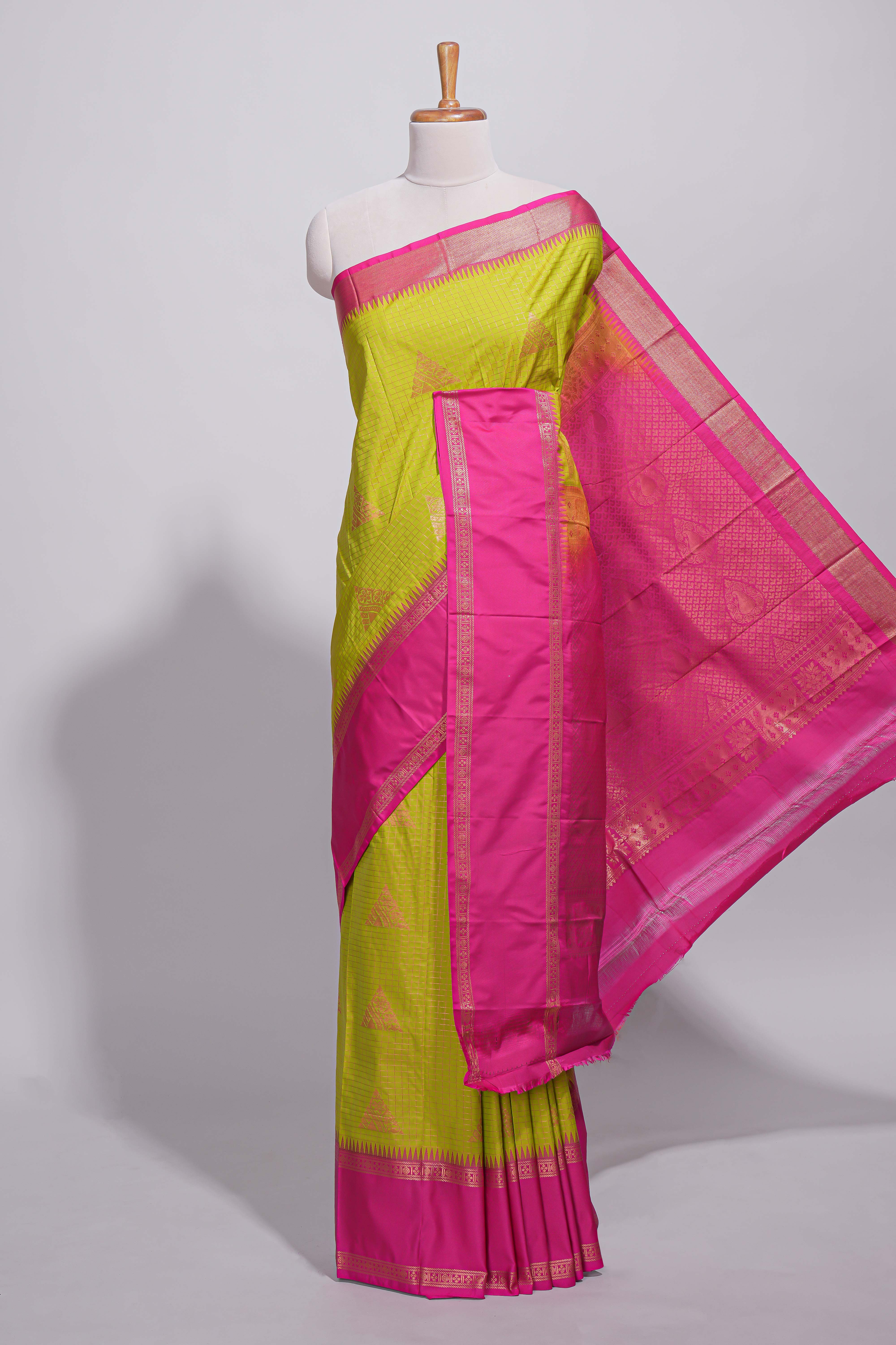 Green color kotta cotton saree with copper zari floral buttas a rich zari border and woven zari pallu with matching blouse piece