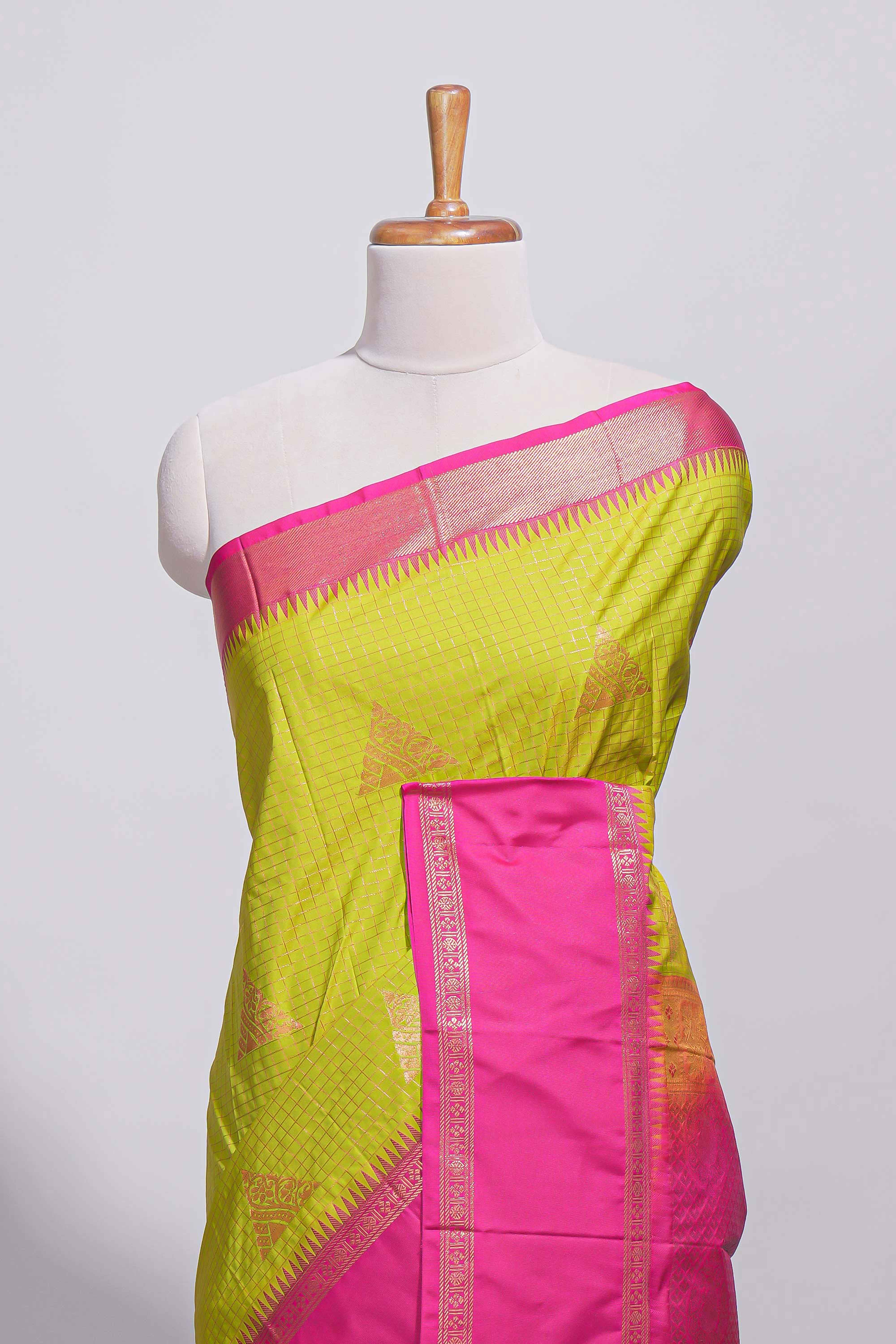 Green color kotta cotton saree with copper zari floral buttas a rich zari border and woven zari pallu with matching blouse piece