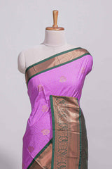 Purple colour kotta cotton saree with copper zari floral buttas a rich zari border and woven zari pallu with matching blouse piece