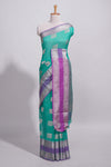 Rama green tussar saree with silver zari square buttas retta petta zari border and woven zari pallu with contrast blouse piece