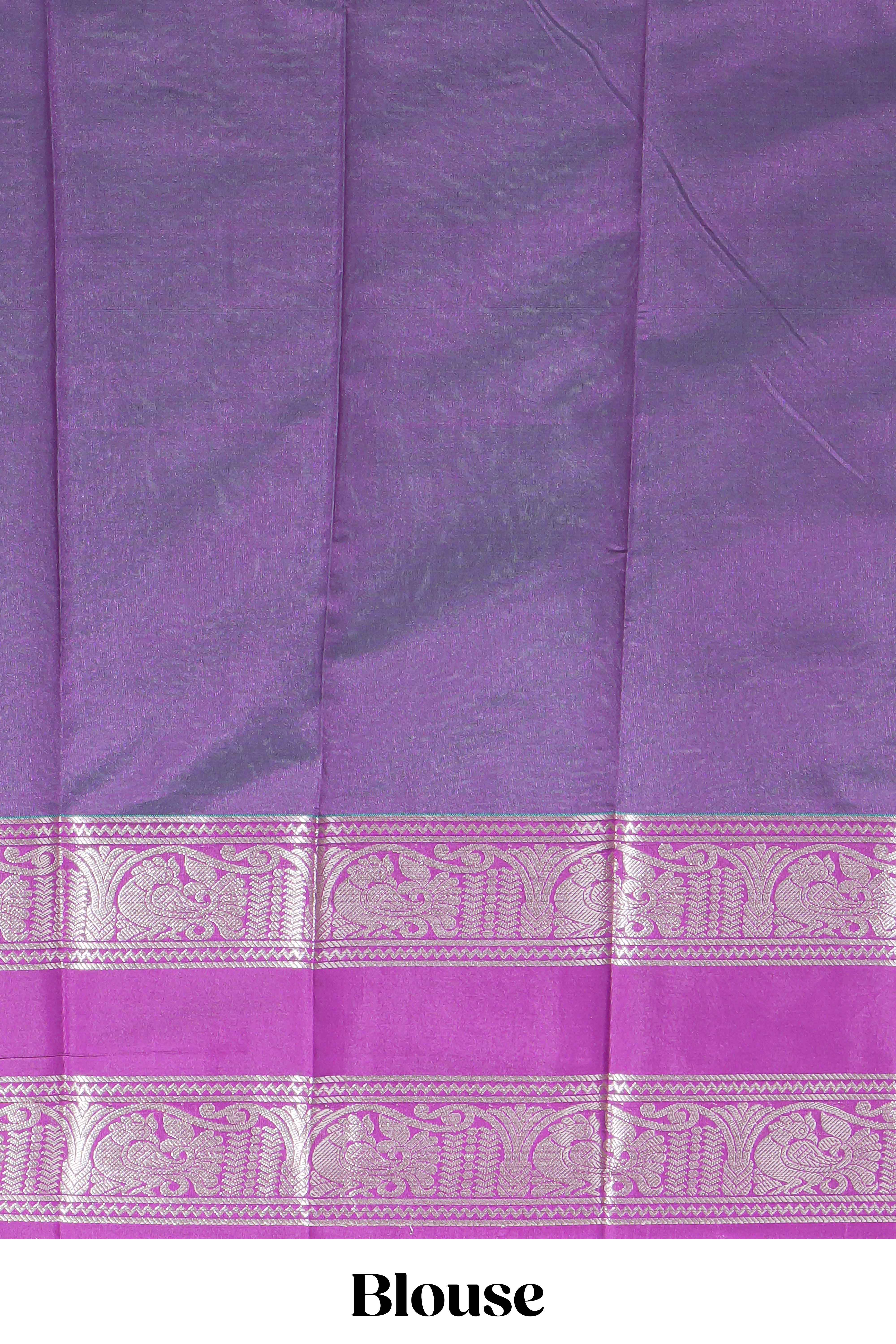 Rama green tussar saree with silver zari square buttas retta petta zari border and woven zari pallu with contrast blouse piece