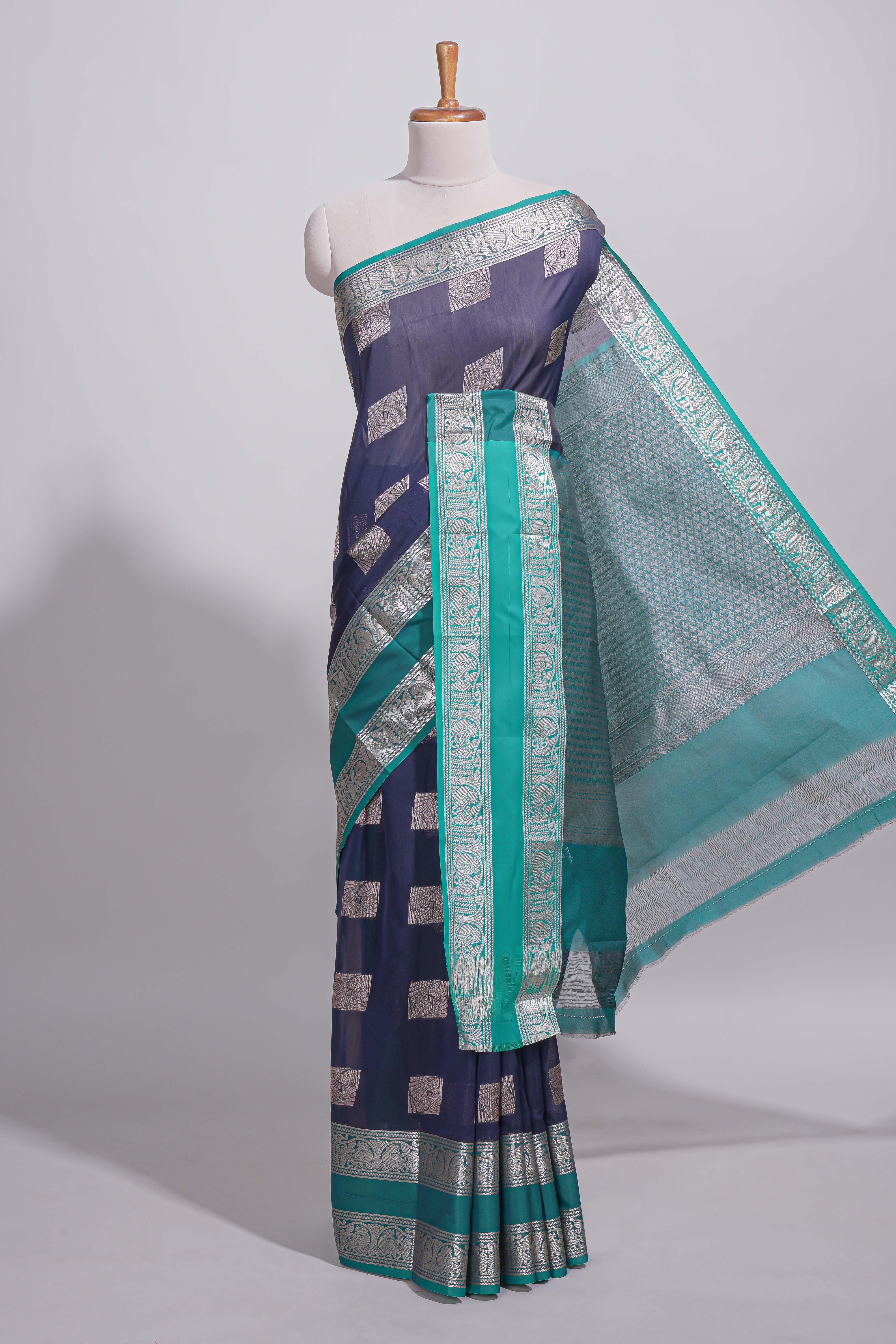 Navy blue tussar saree with silver zari square buttas retta petta zari border and woven zari pallu with contrast blouse piece