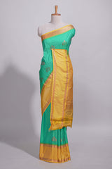 Rama green kotta cotton saree with zari floral buttas a rich zari border and woven zari pallu with matching blouse piece