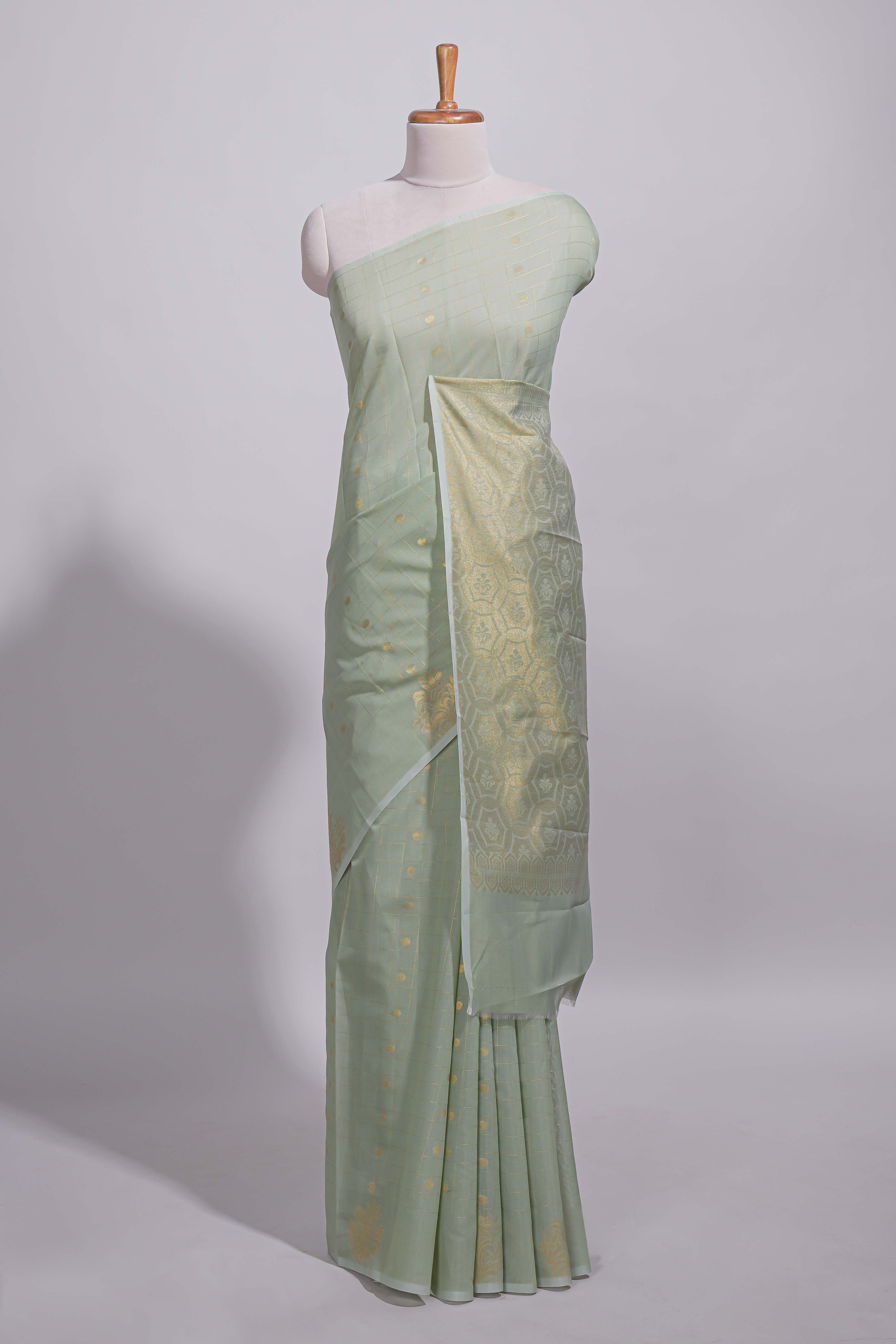 Pastel green Kotta saree with gold woven checks and buttawith rich gold zari woven pallu with matching blouse