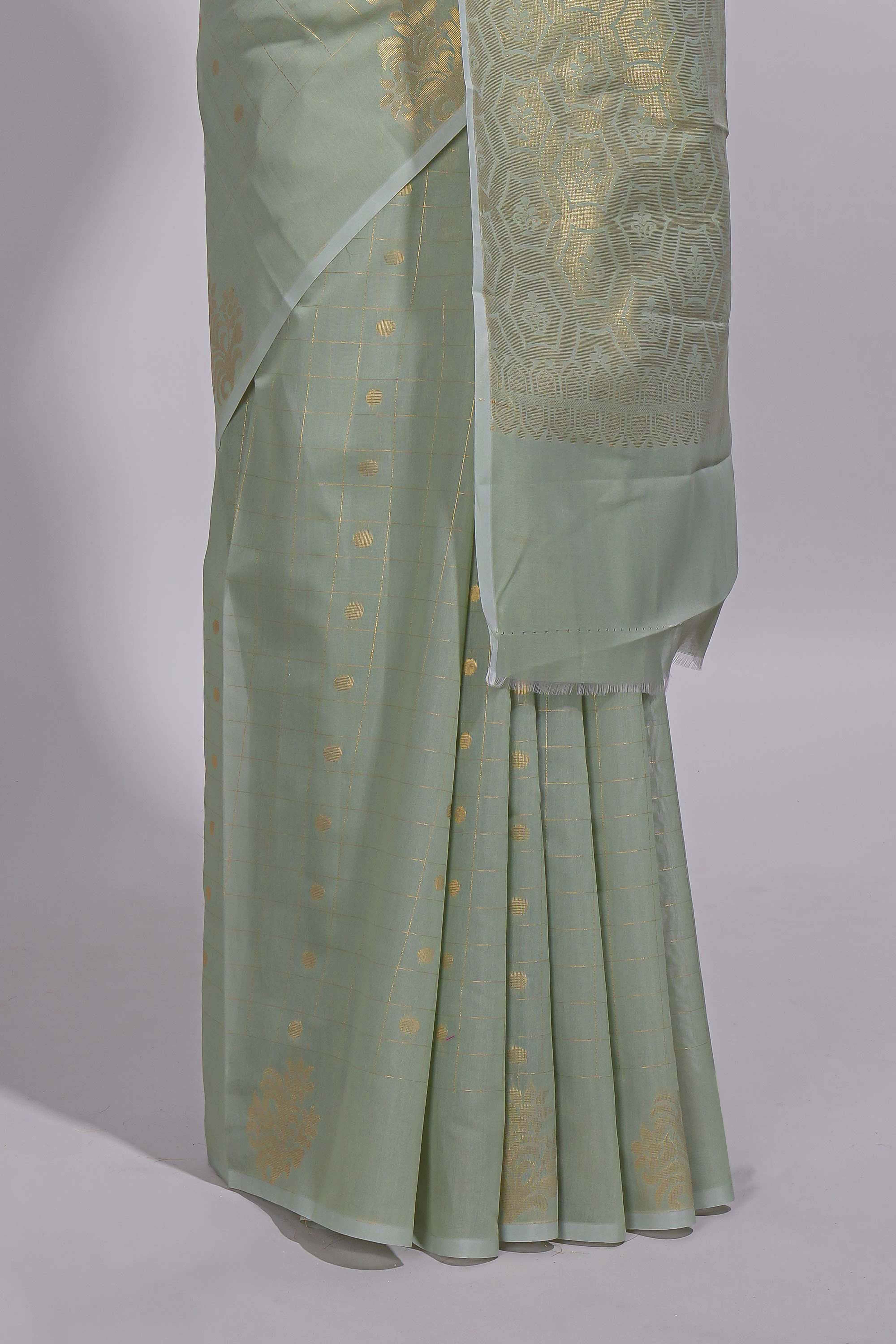 Pastel green Kotta saree with gold woven checks and buttawith rich gold zari woven pallu with matching blouse