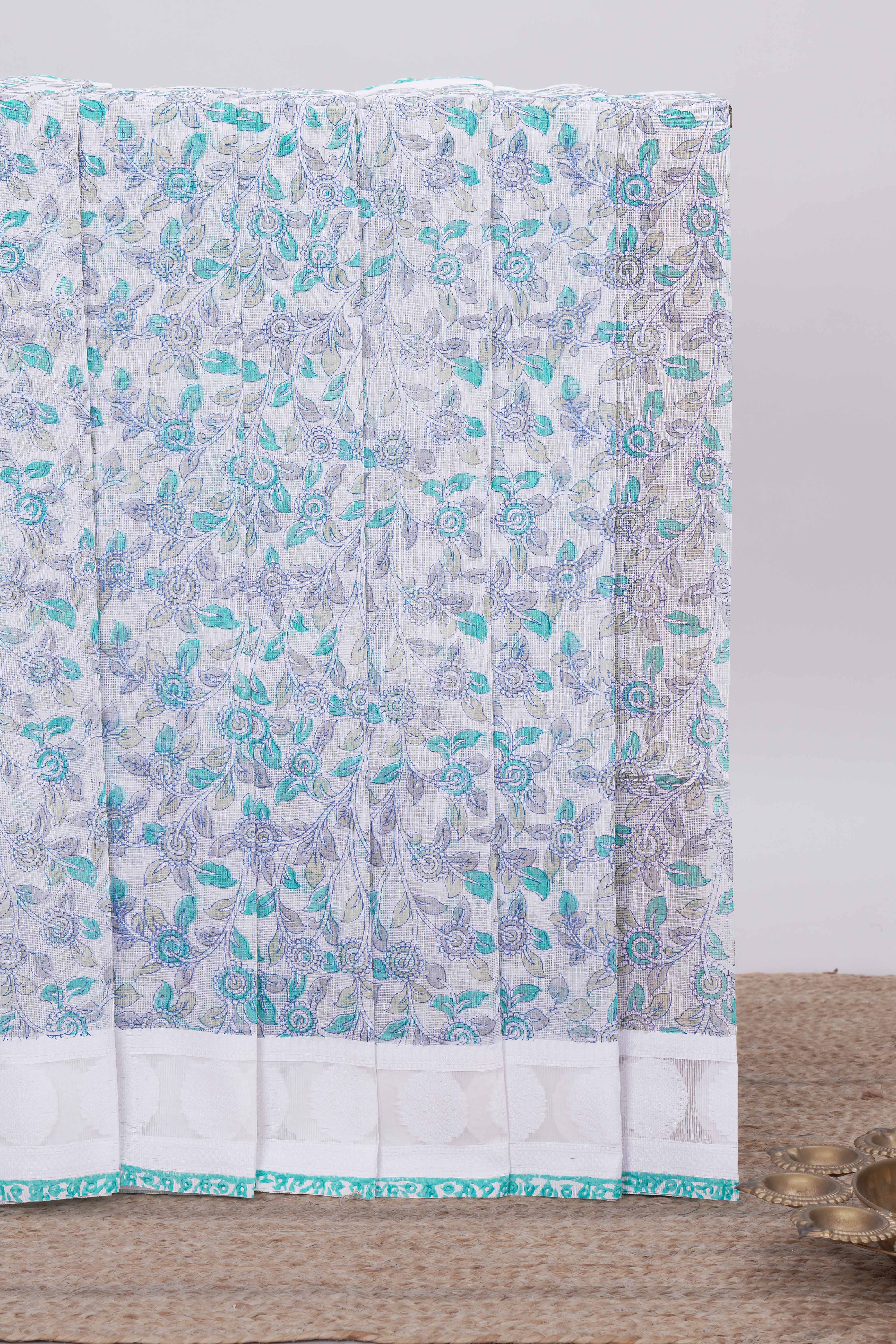 Off white floral design kota cotton saree with self border and matching motifs blouse