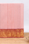 Peach plain kota saree with contrast zari border and self striped pallu