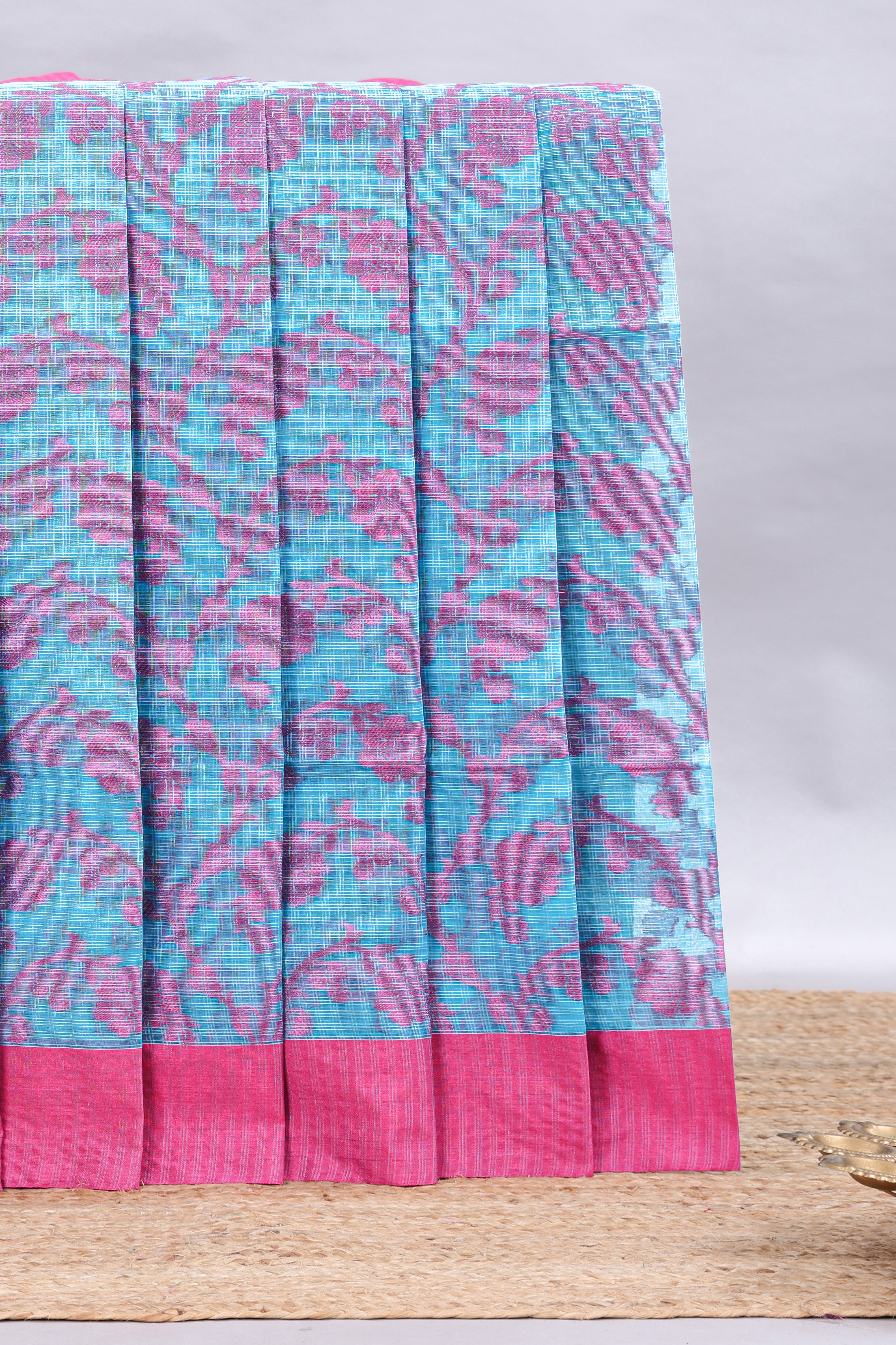Blue checked floral design kota cotton saree with contrast border and striped blouse