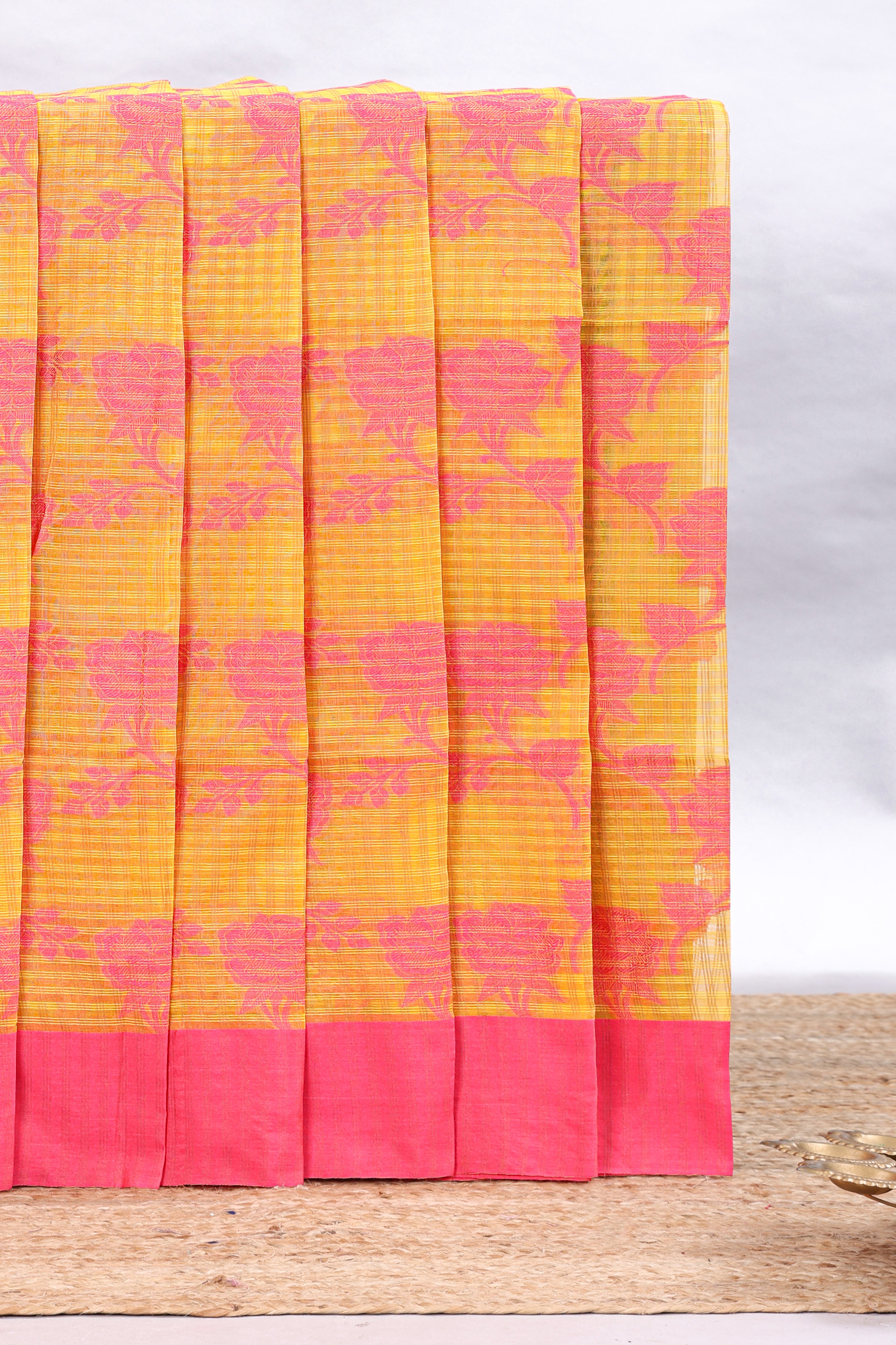 Yellow checked floral design kota cotton saree with contrast border and striped blouse