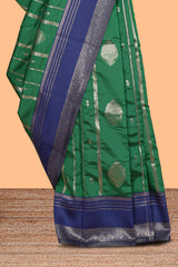 Green striped zari motifs design kota cotton saree with contrast zari border and motifs blouse
