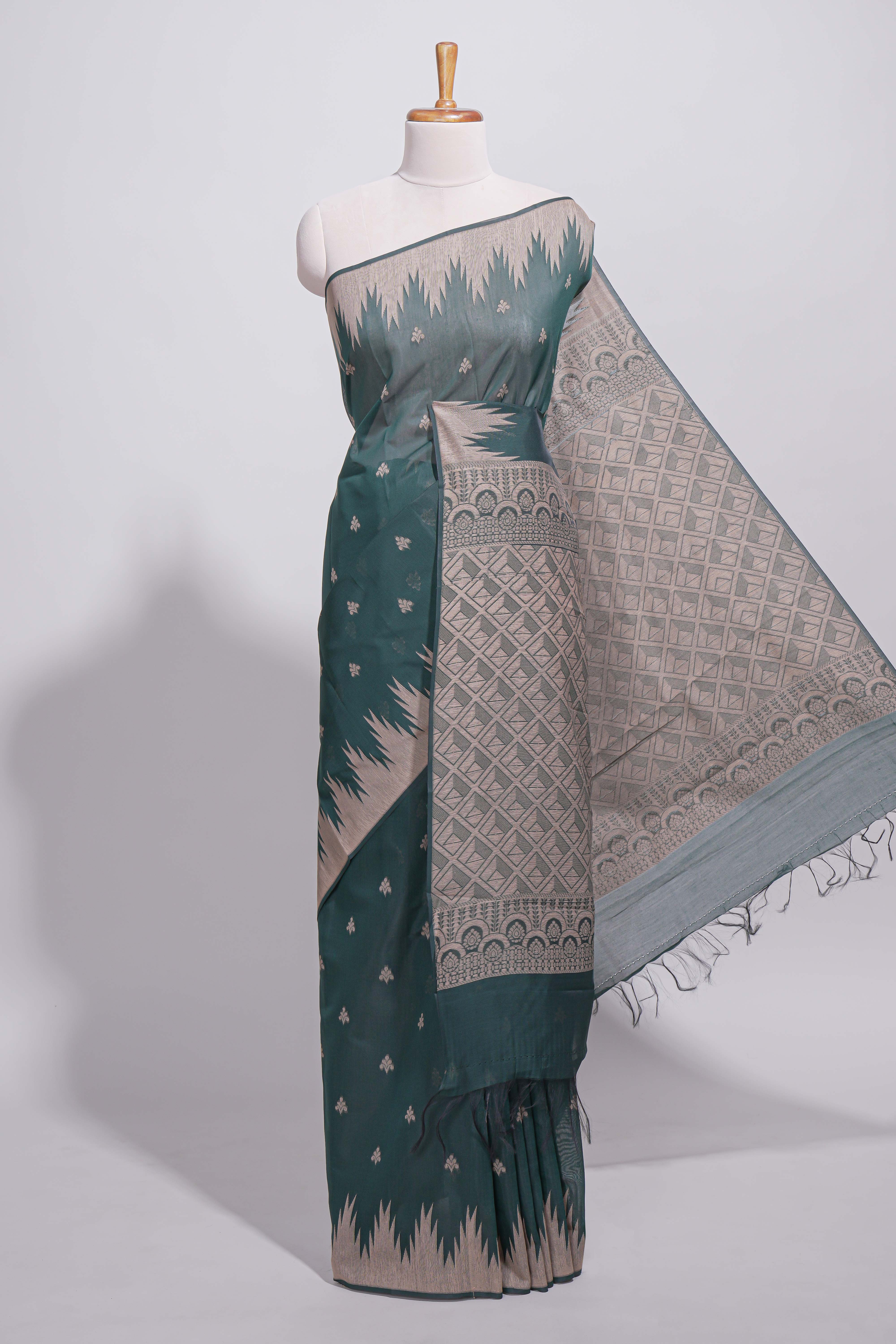 Dark green kotta cotton saee with gold zari buttas a zari border with temple design and zari woven pallu with matching blouse piece