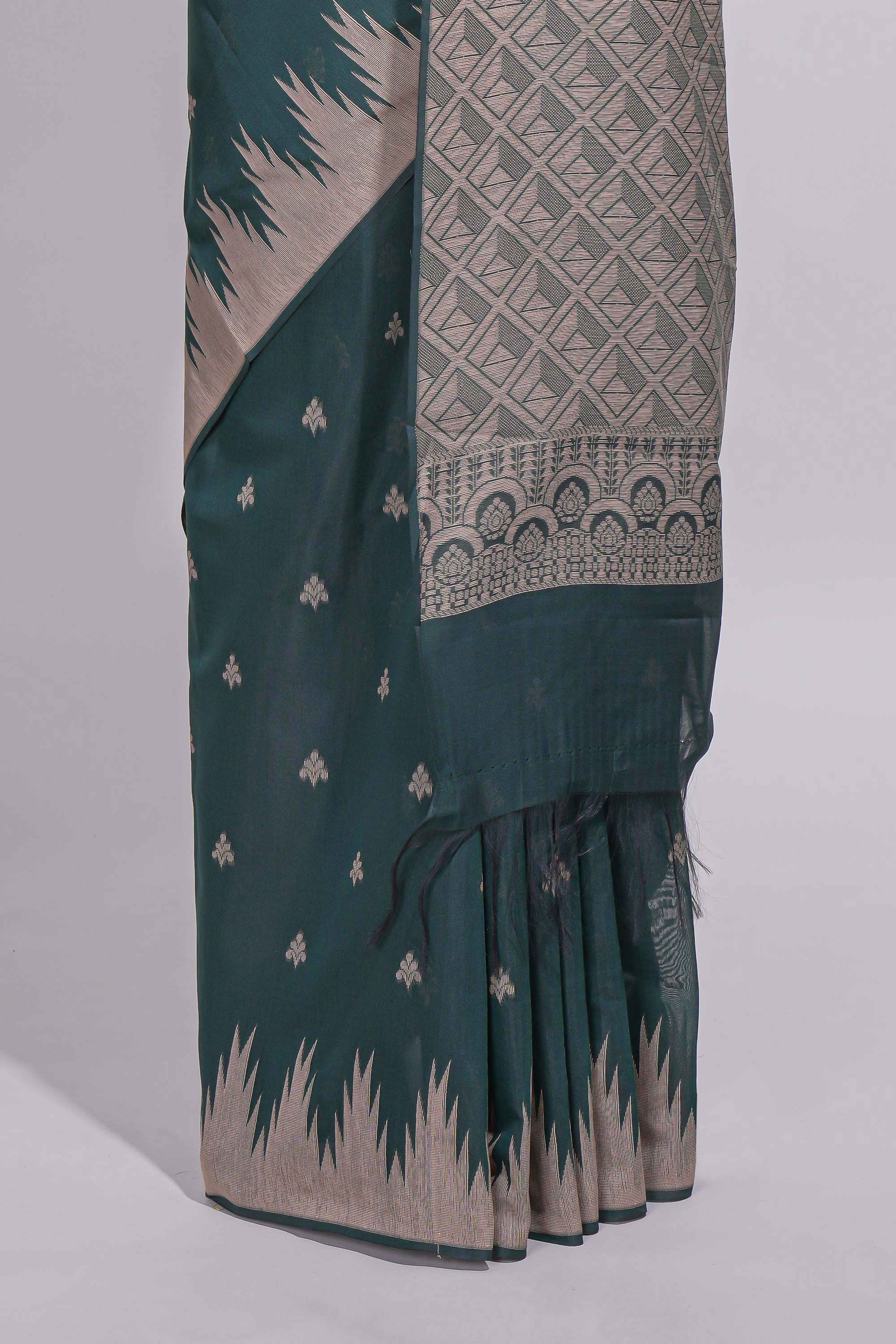 Dark green kotta cotton saee with gold zari buttas a zari border with temple design and zari woven pallu with matching blouse piece
