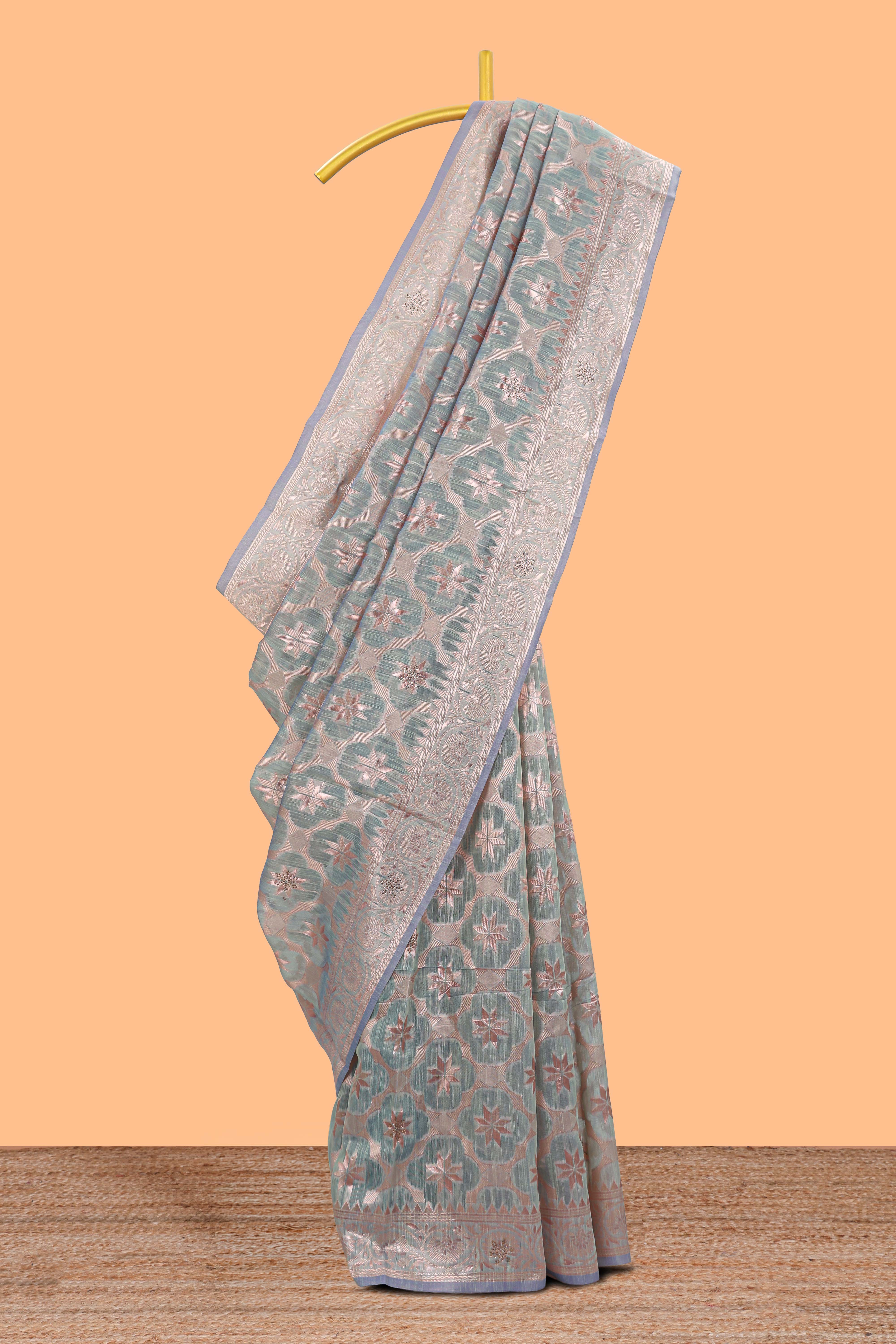 Powder green floral motifs design kota cotton saree with self zari border and contrast blouse