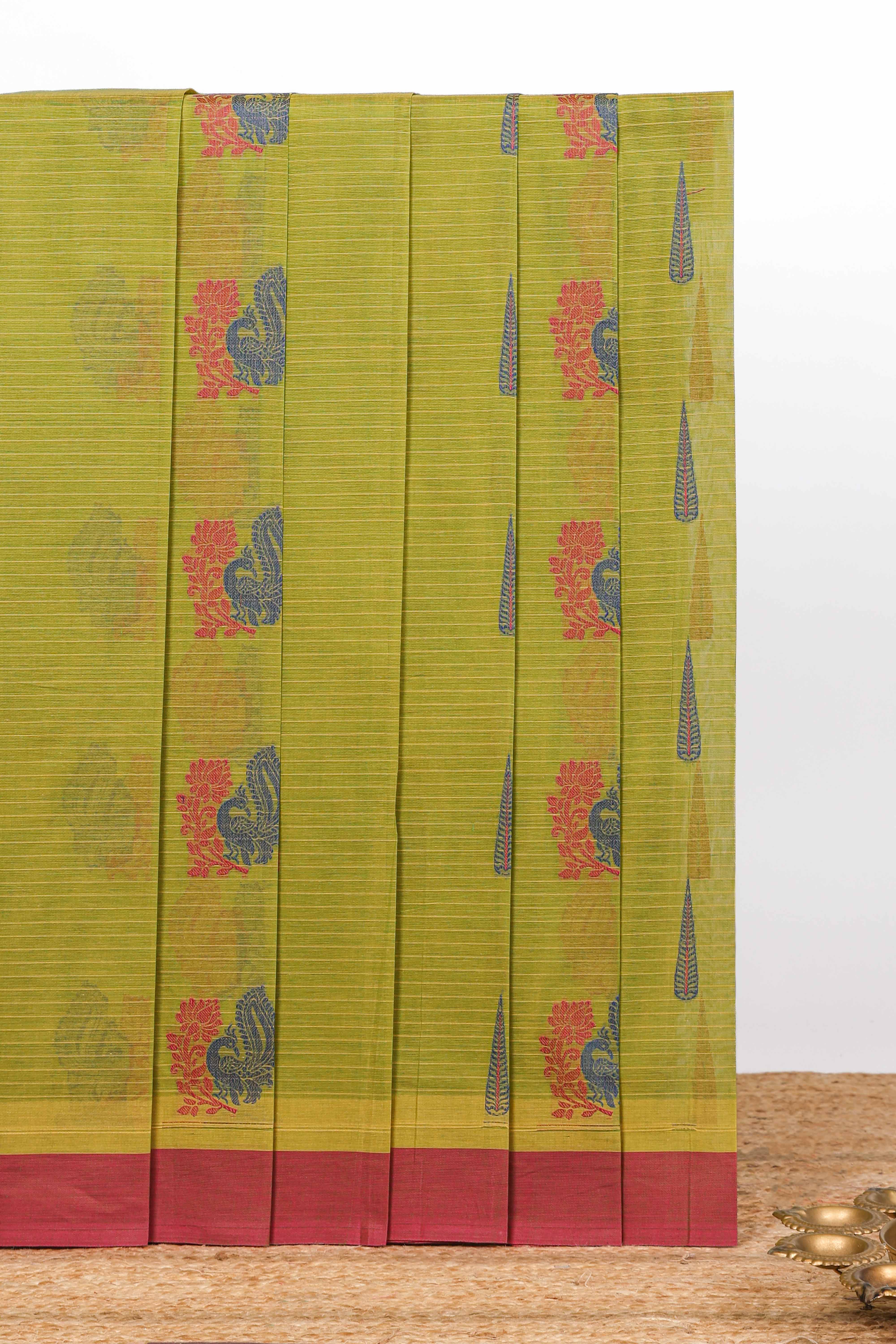 Olive green paisley and teardrop motif designs kovai cotton saree with contrast border and matching blouse