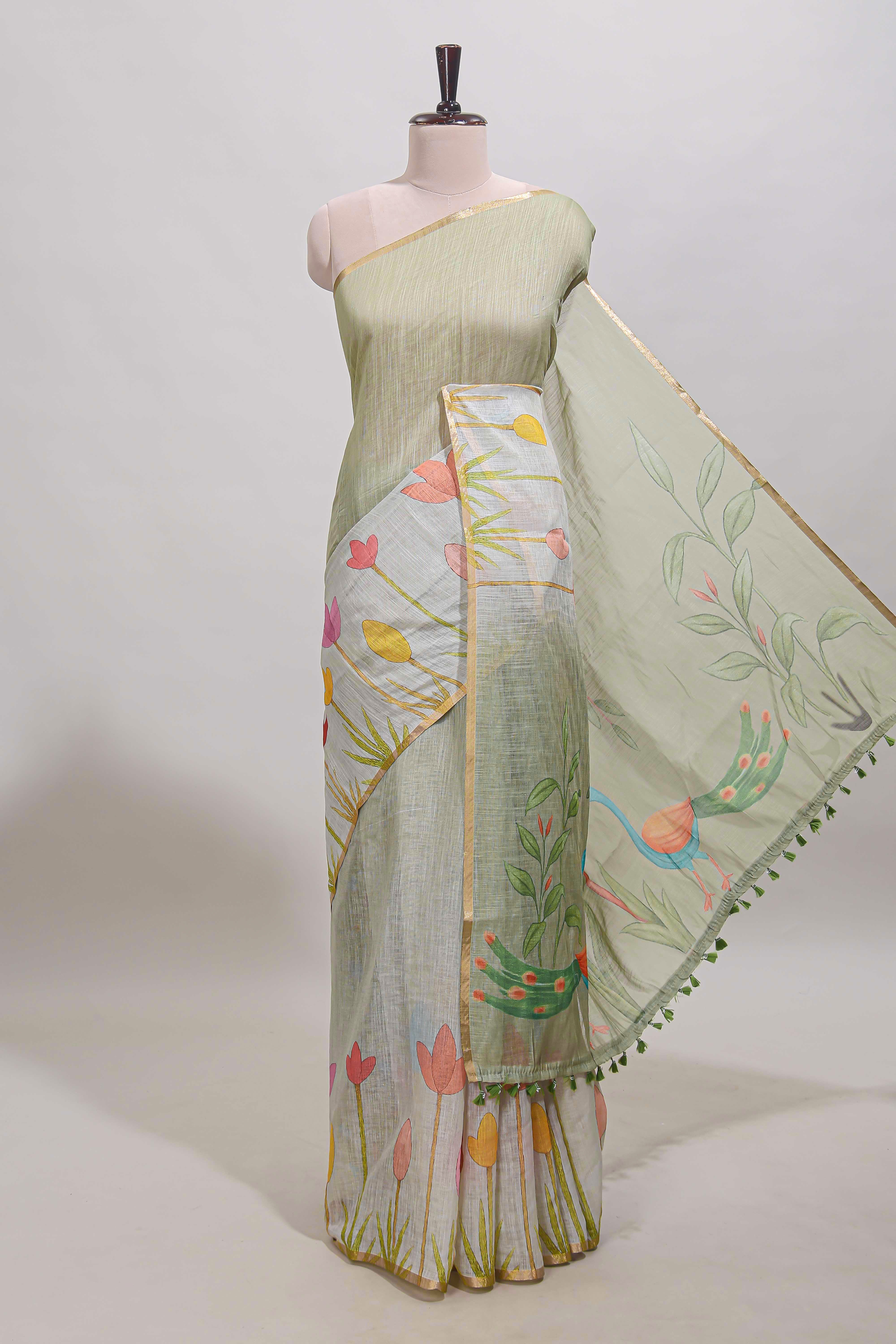 Light green floral design linen cotton saree with self zari border and matching blouse