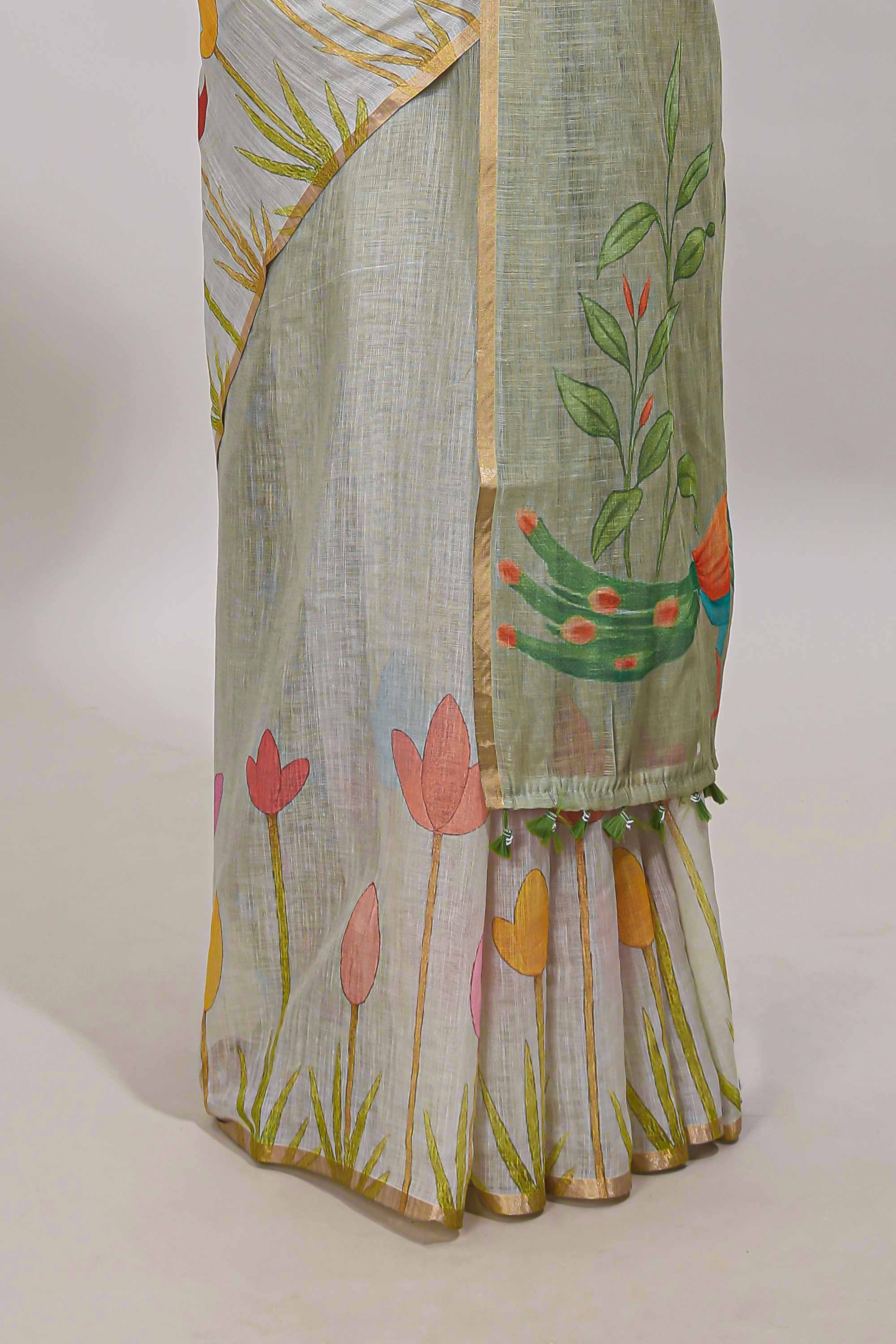 Light green floral design linen cotton saree with self zari border and matching blouse