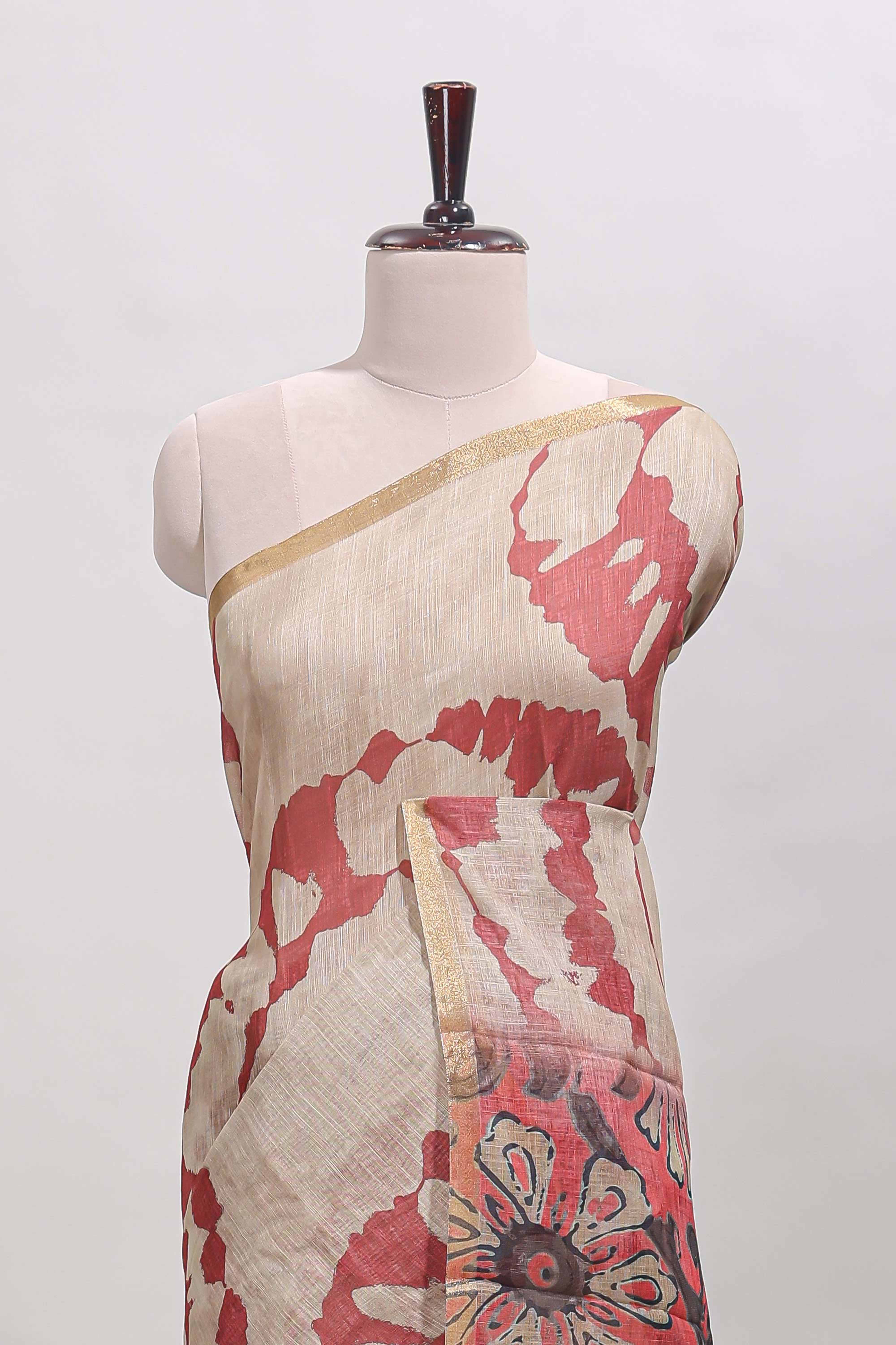 Beige linen cotton saree with red shibori print, self zari border and floral design pallu