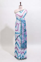 Off white chevron style shibori print linen cotton saree with contrast turquoise blue border and ikkat design pallu