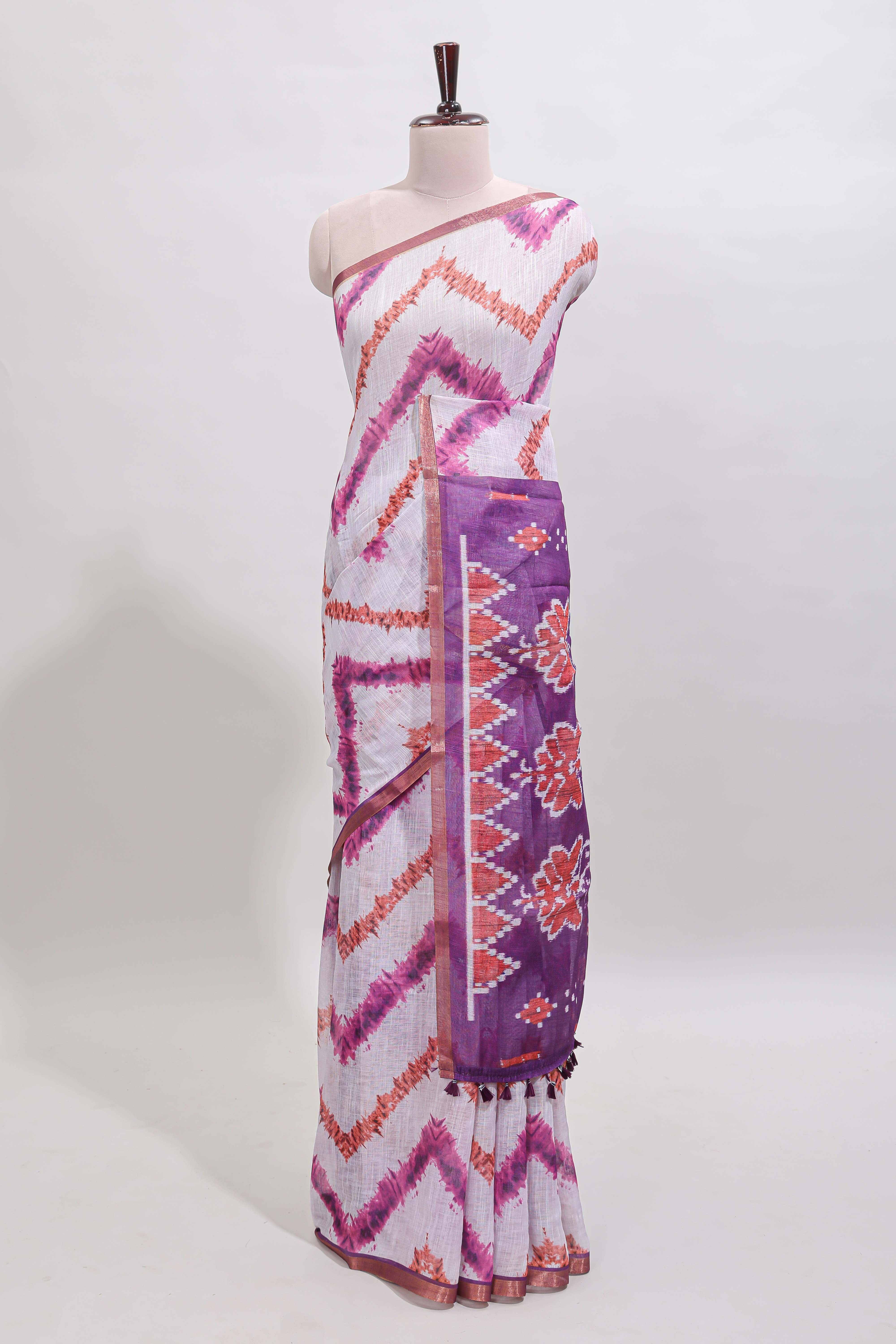 Off white chevron style shibori print linen cotton saree with contrast purple border and ikkat design pallu