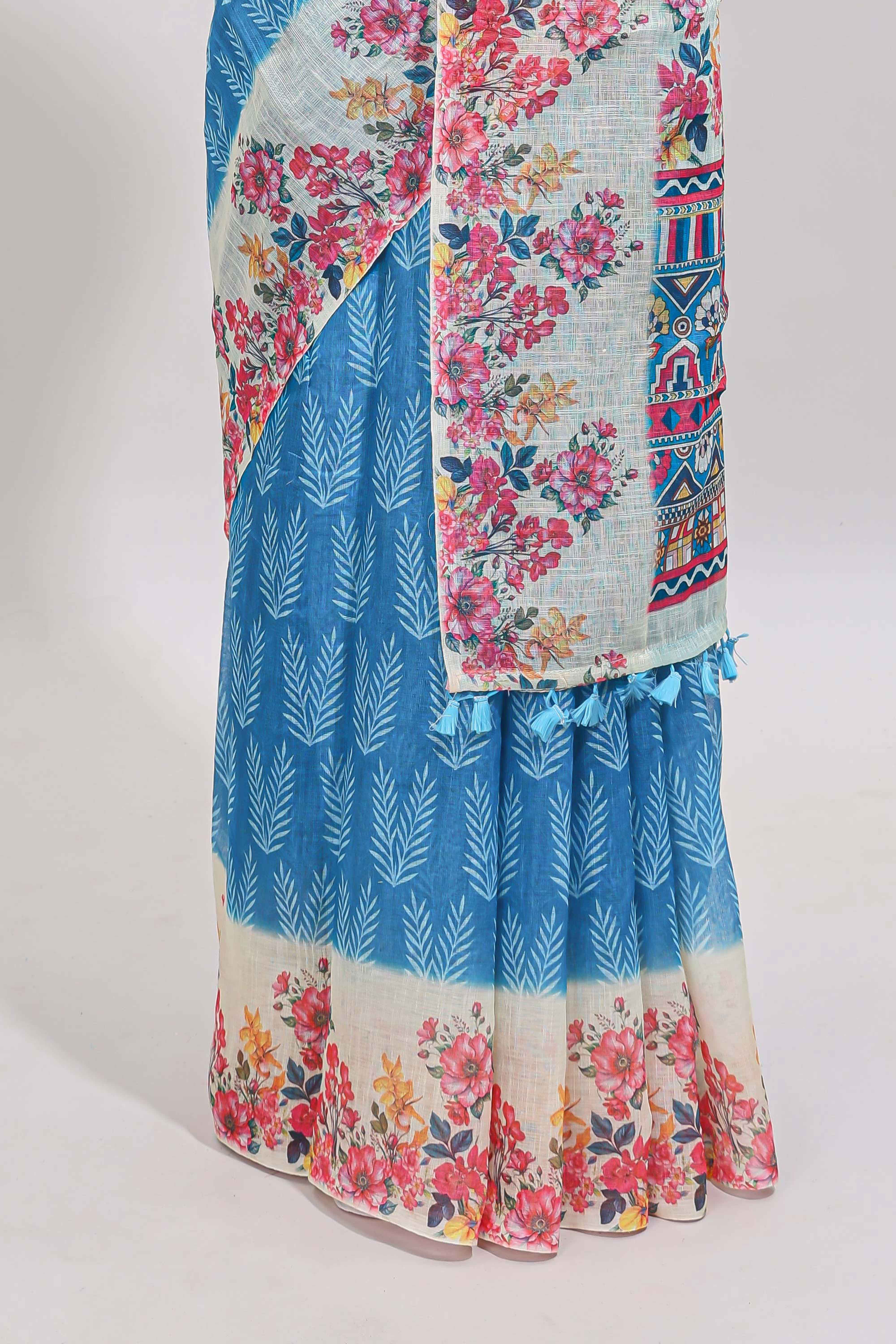 Blue leaf print linen cotton saree with contrast floral design border and matching blouse