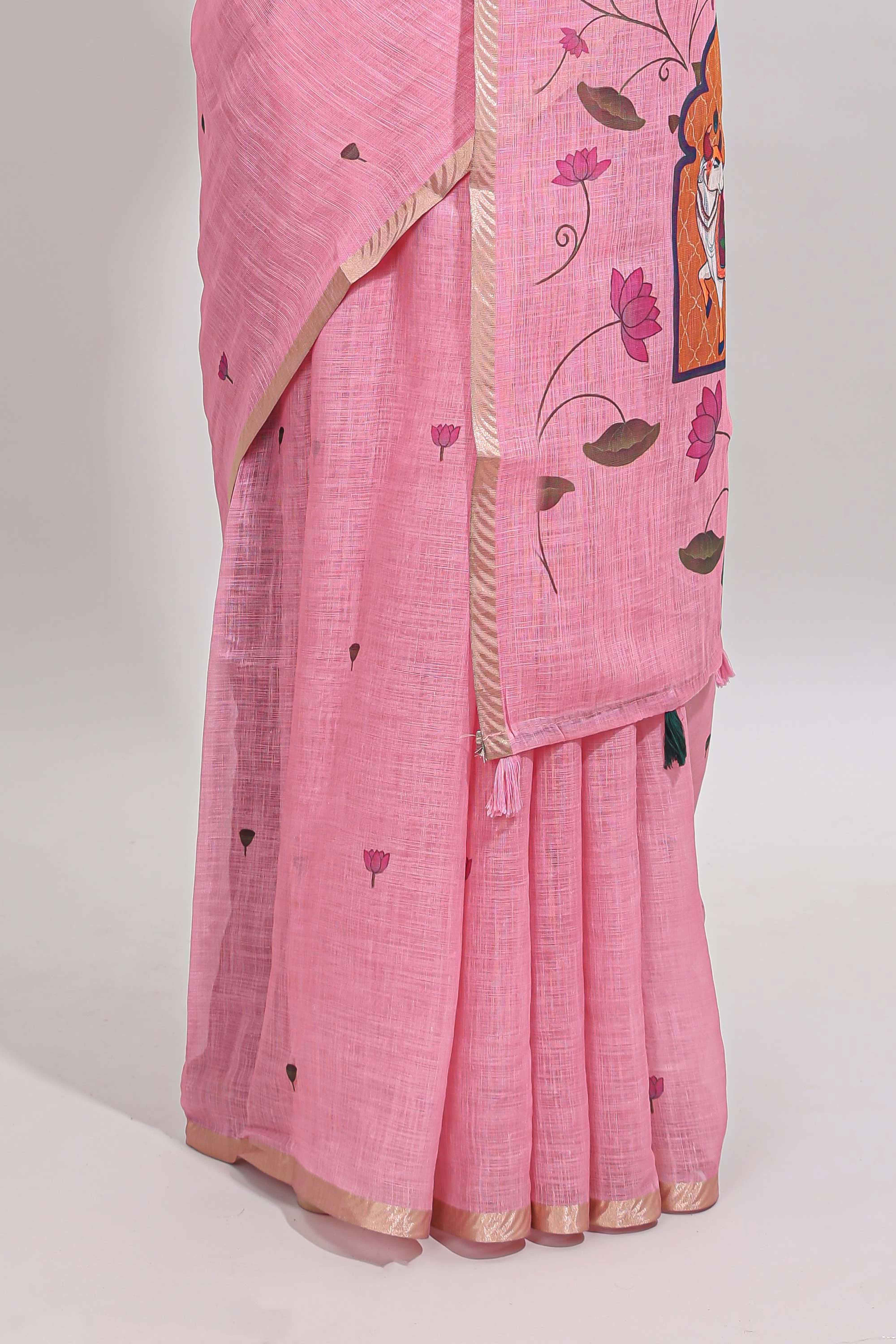 Pink floral design linen cotton saree with self zari border, matching pallu and contrast blouse
