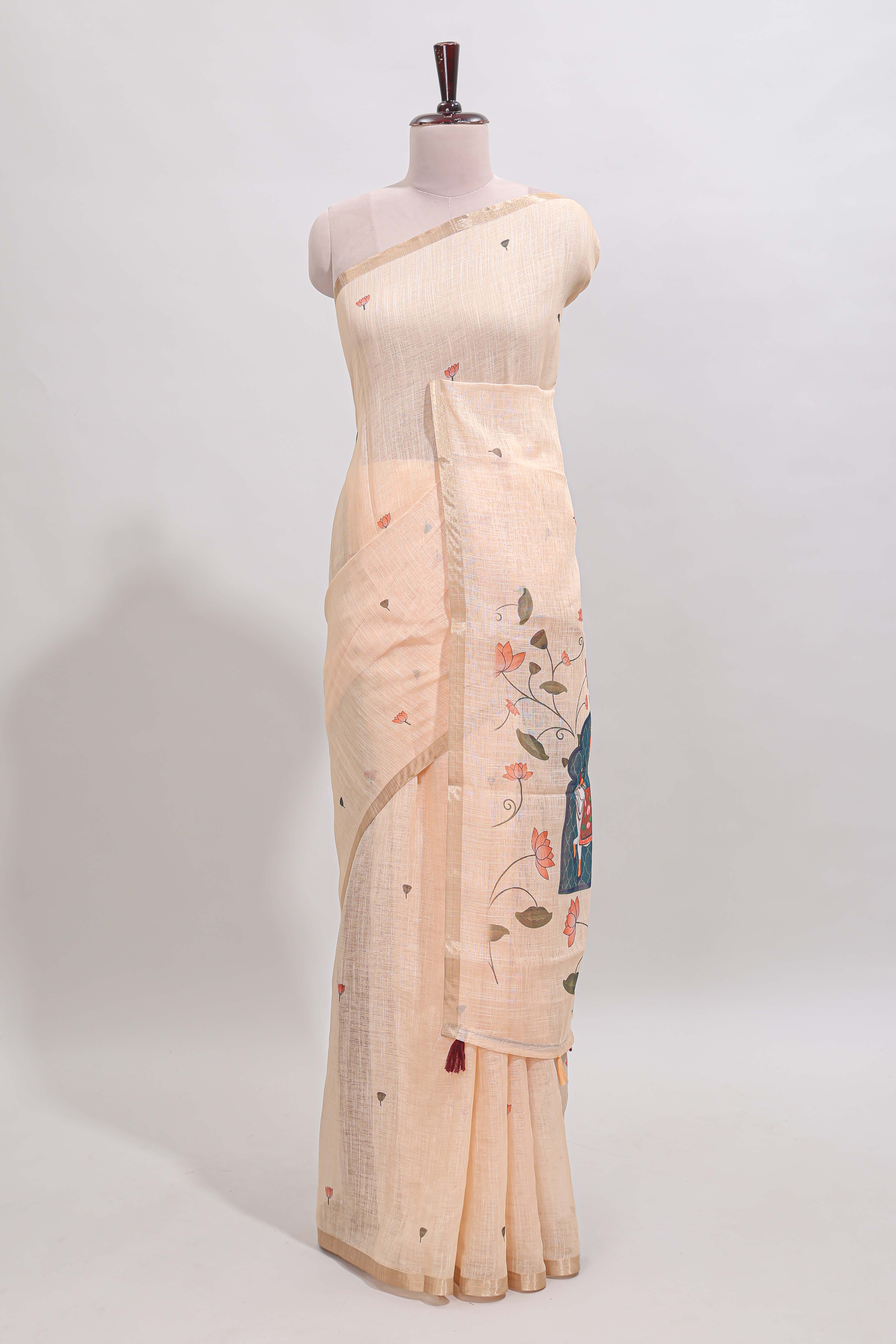Cream floral design linen cotton saree with self zari border, matching pallu and contrast blouse