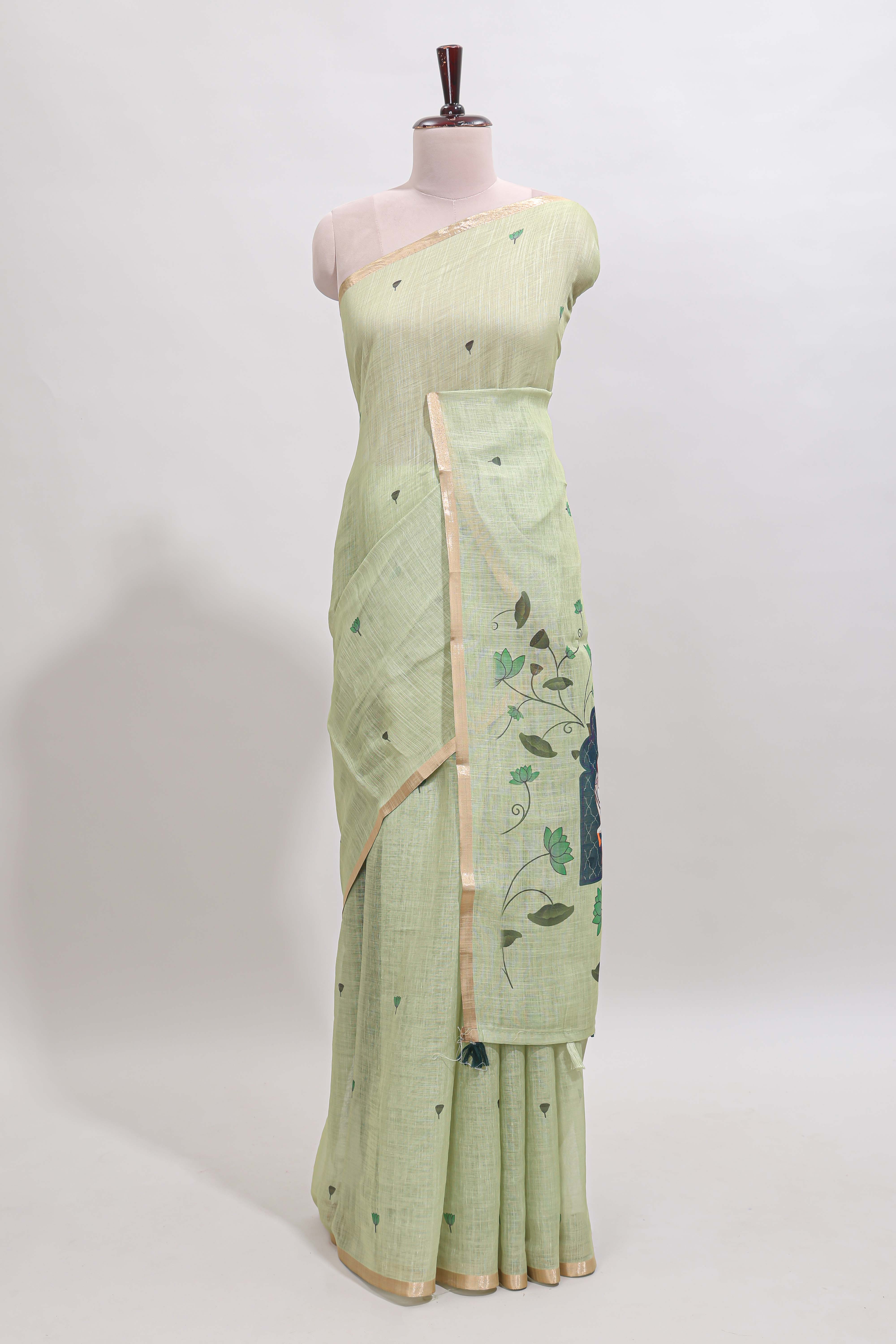 Green floral design linen cotton saree with self zari border, matching pallu and contrast blouse