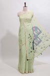 Green floral design linen cotton saree with self zari border, matching pallu and contrast blouse