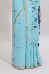 Blue floral design linen cotton saree with self zari border, matching pallu and contrast blouse