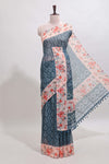 Midnight green floral design linen cotton saree with contrast floral design border and matching blouse