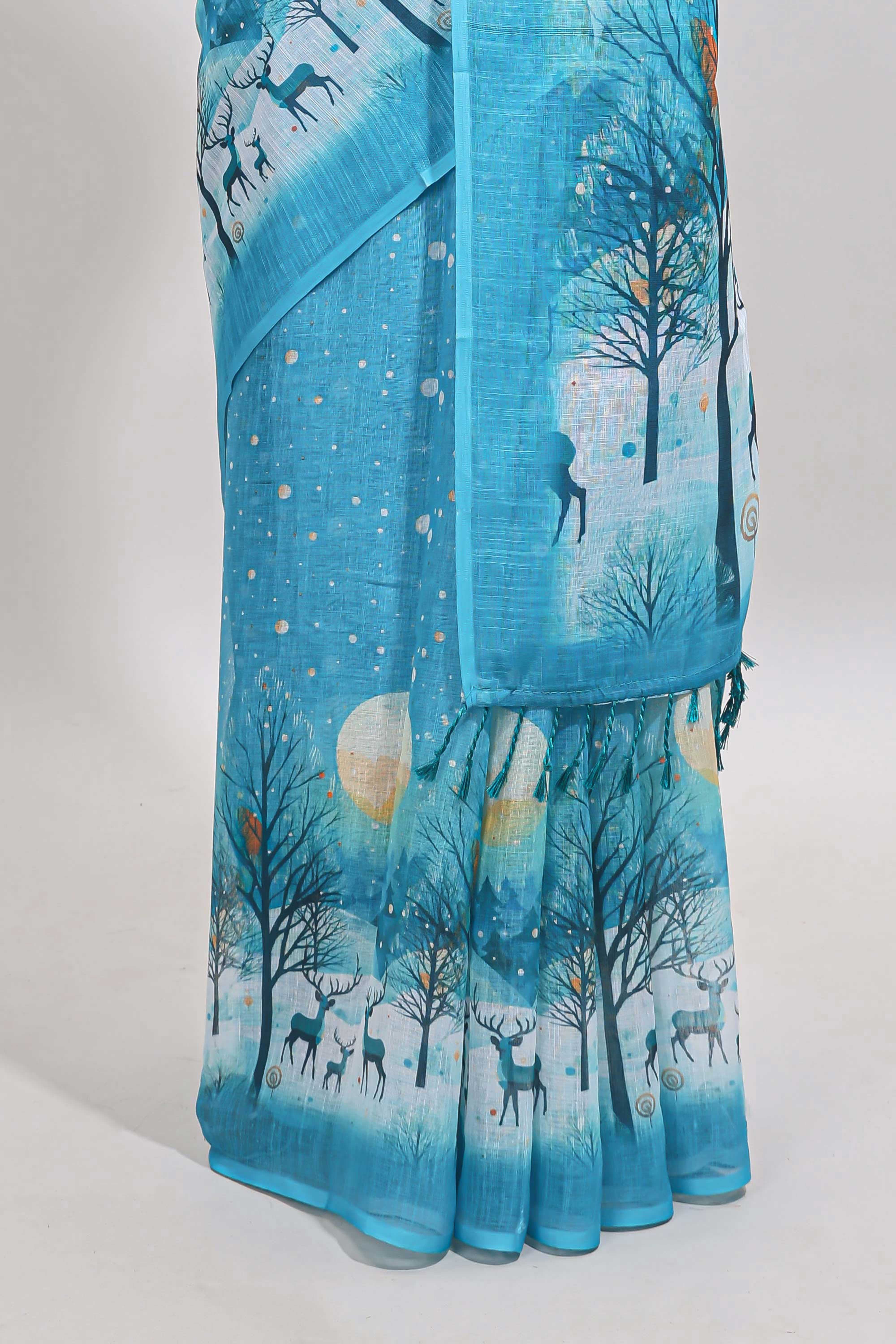 Turquoise blue winter themed linen cotton saree with self border and matching blouse