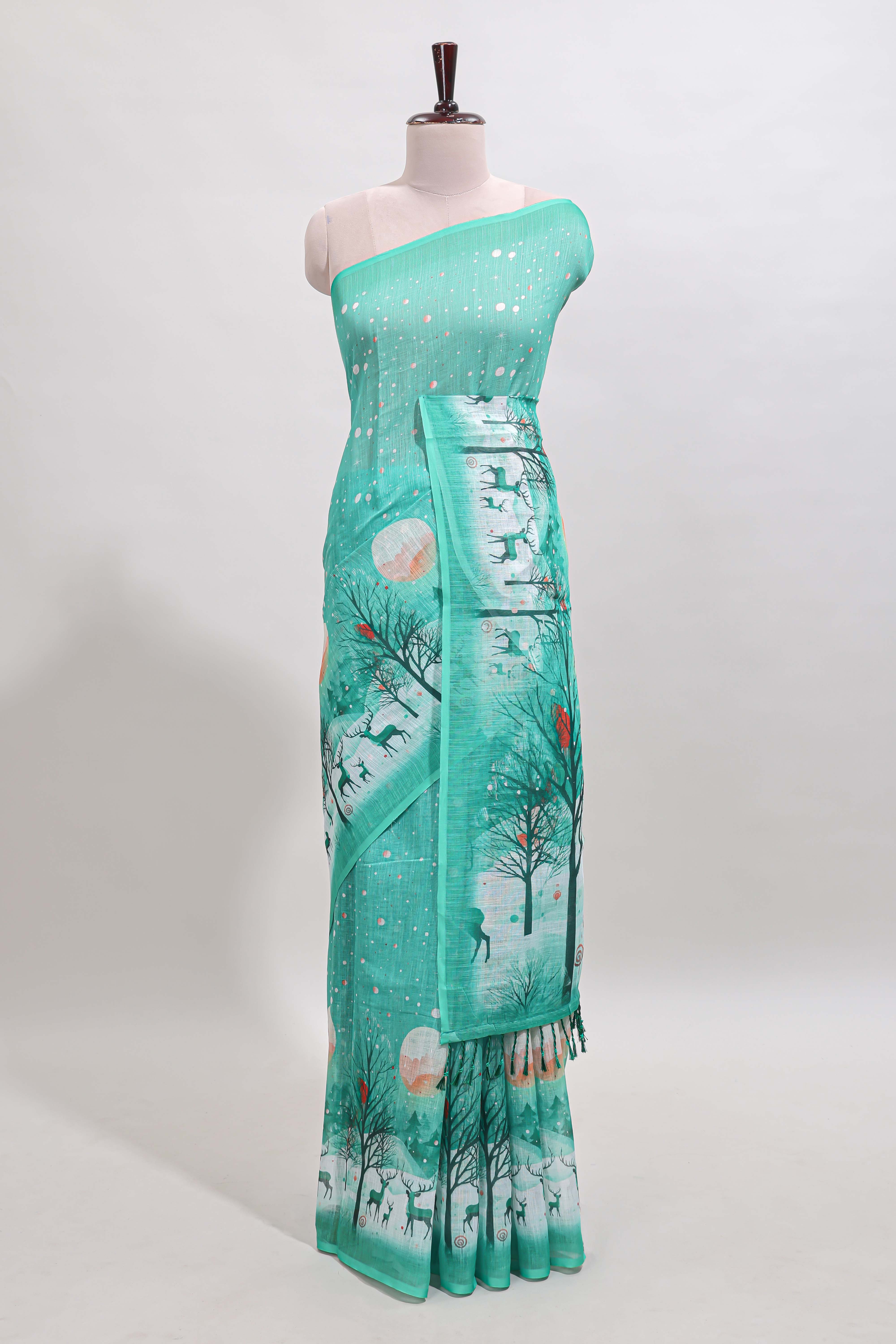 Turquoise green winter themed linen cotton saree with self border and matching blouse