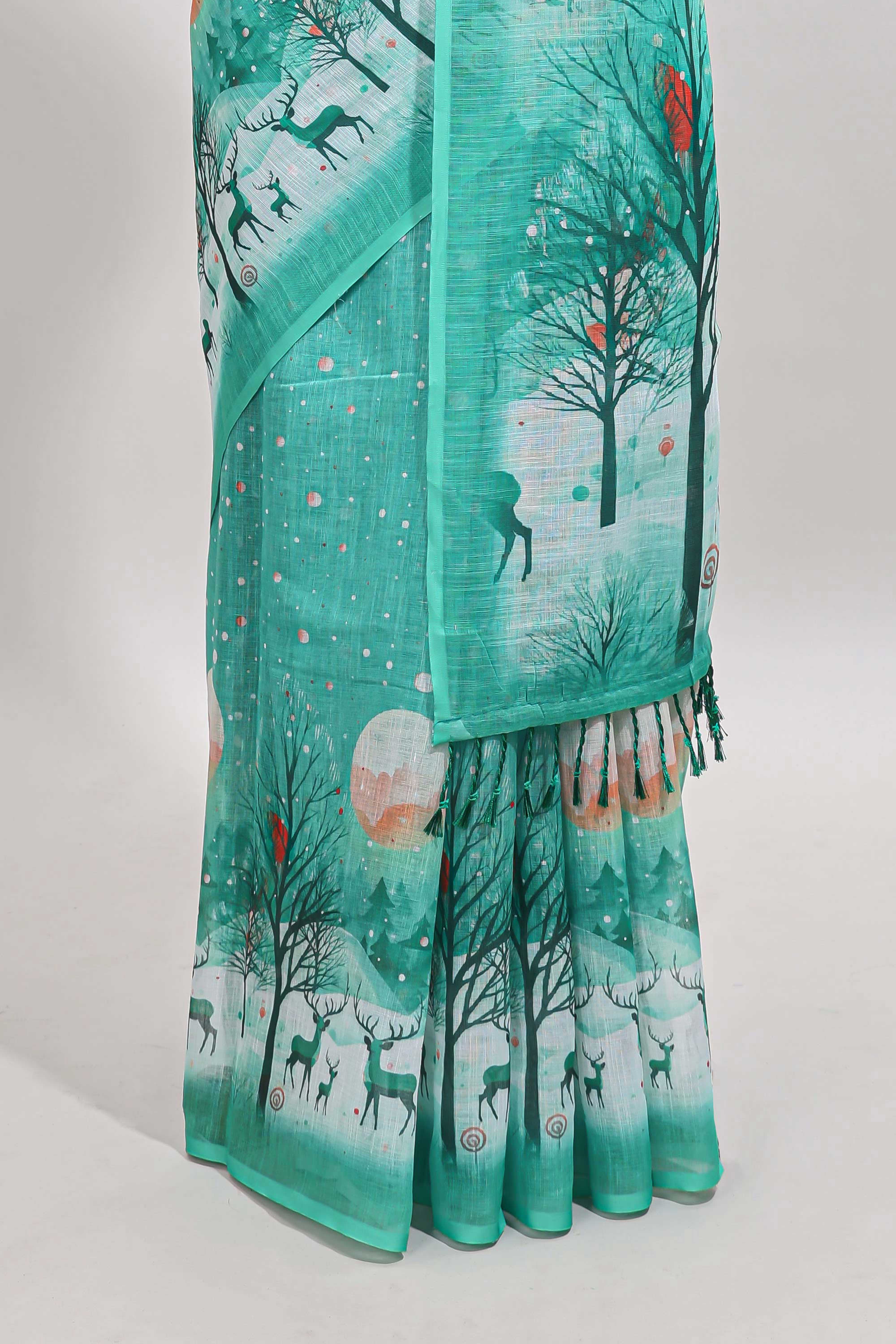 Turquoise green winter themed linen cotton saree with self border and matching blouse