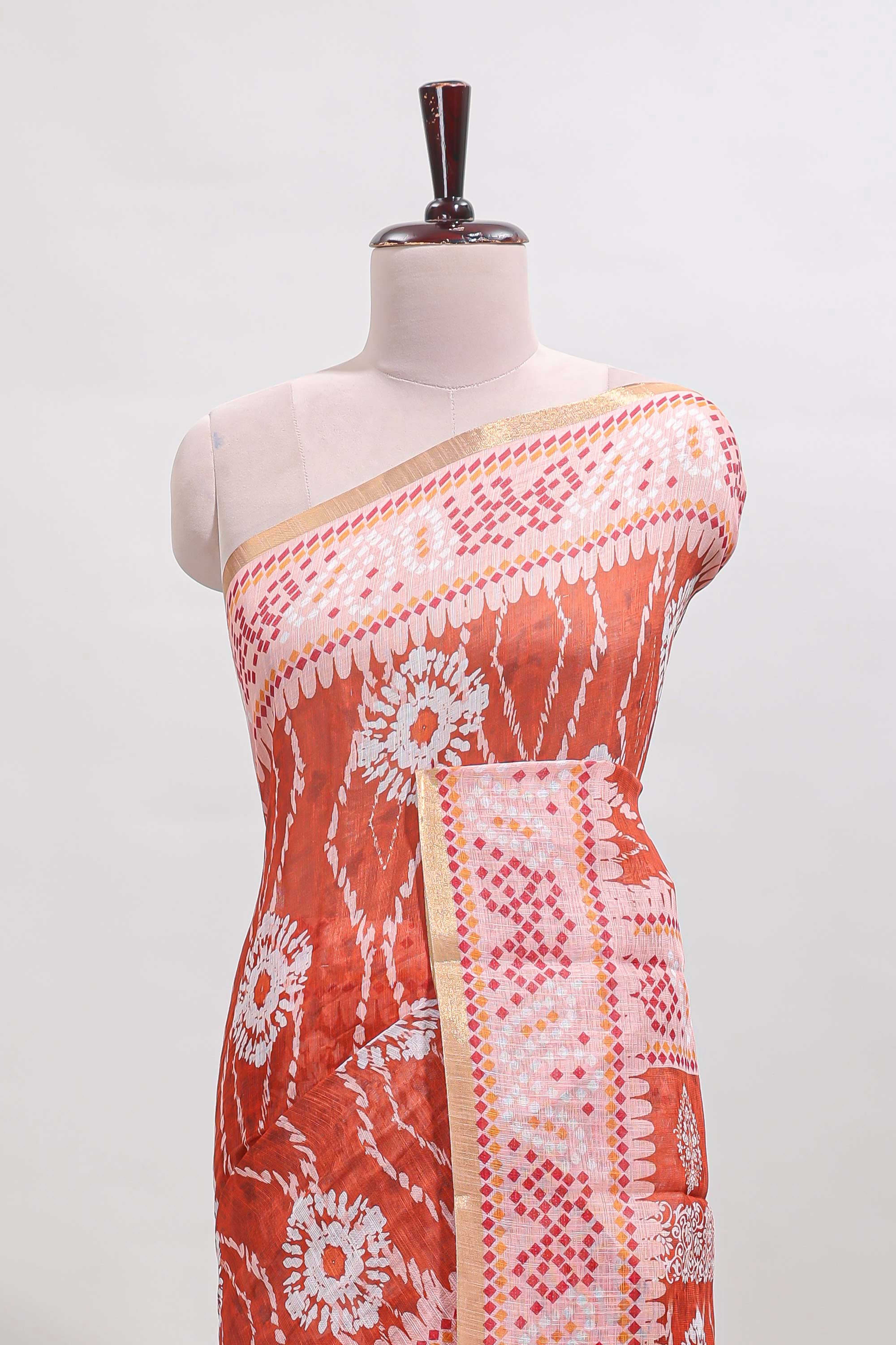 Orange shibori print motifs linen cotton saree with contrast border and matching blouse