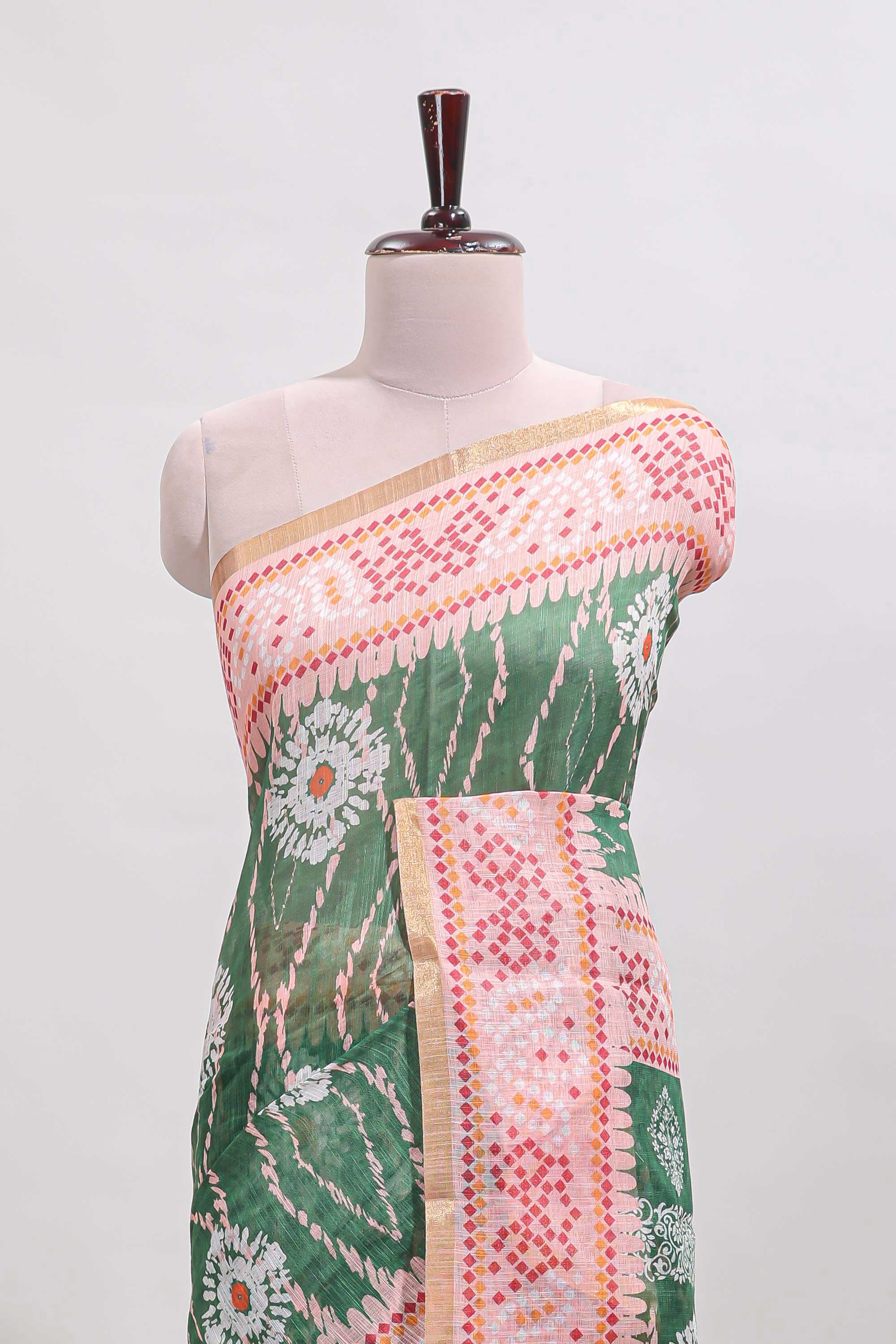 Green shibori print motifs linen cotton saree with contrast border and matching blouse