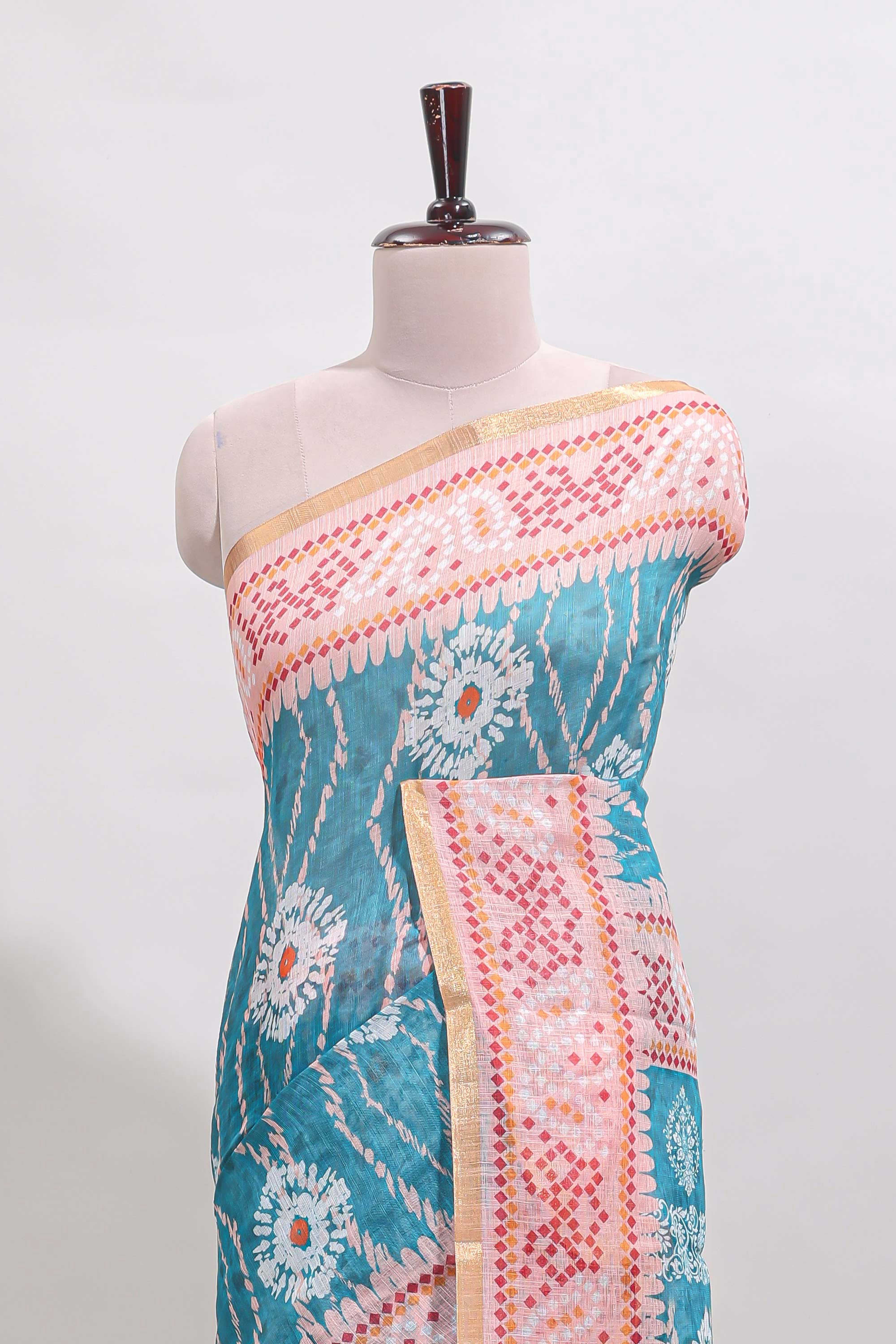Blue shibori print motifs linen cotton saree with contrast border and matching blouse