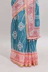 Blue shibori print motifs linen cotton saree with contrast border and matching blouse