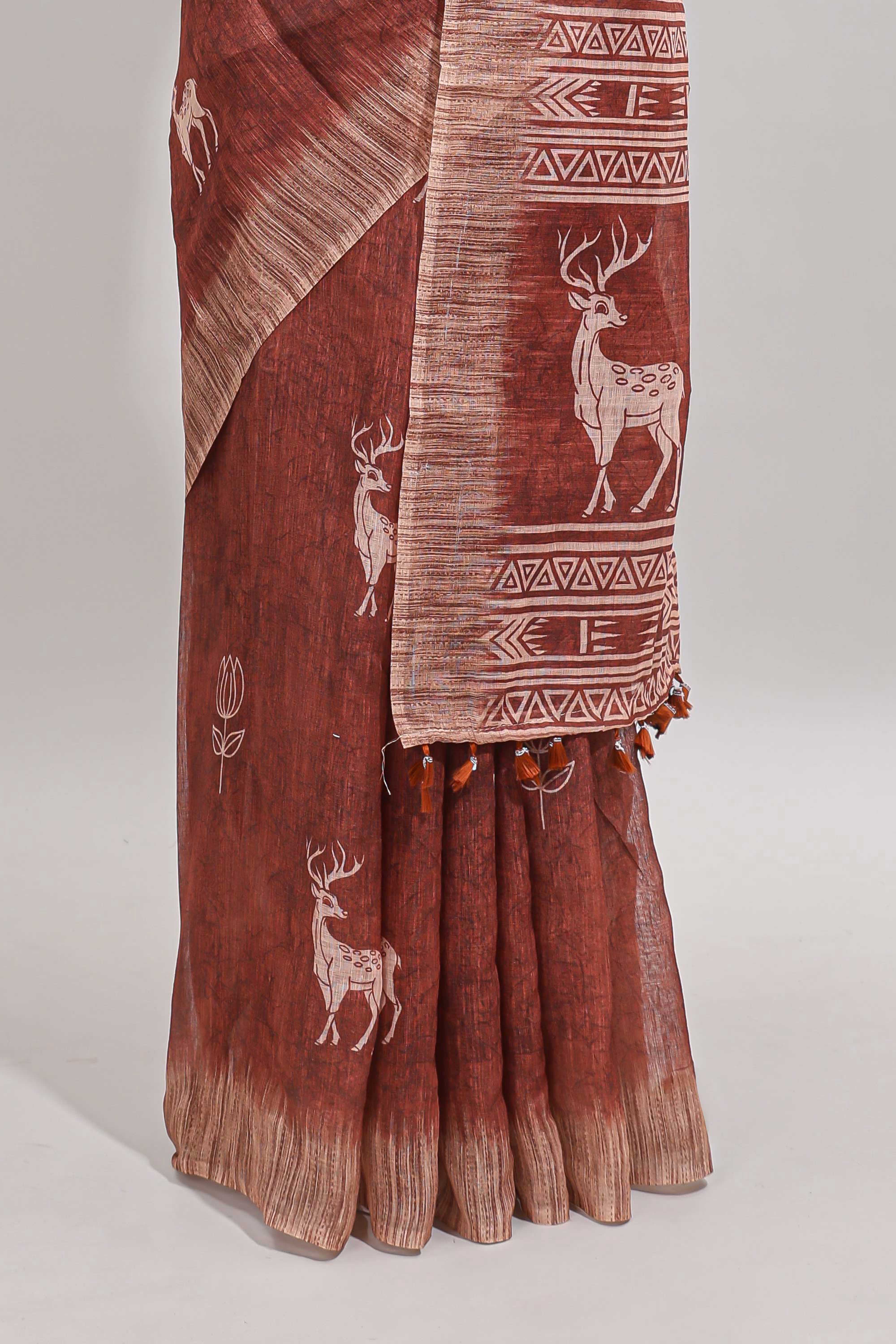 Orange floral & deer design motifs linen cotton saree with contrast border and matching printed blouse