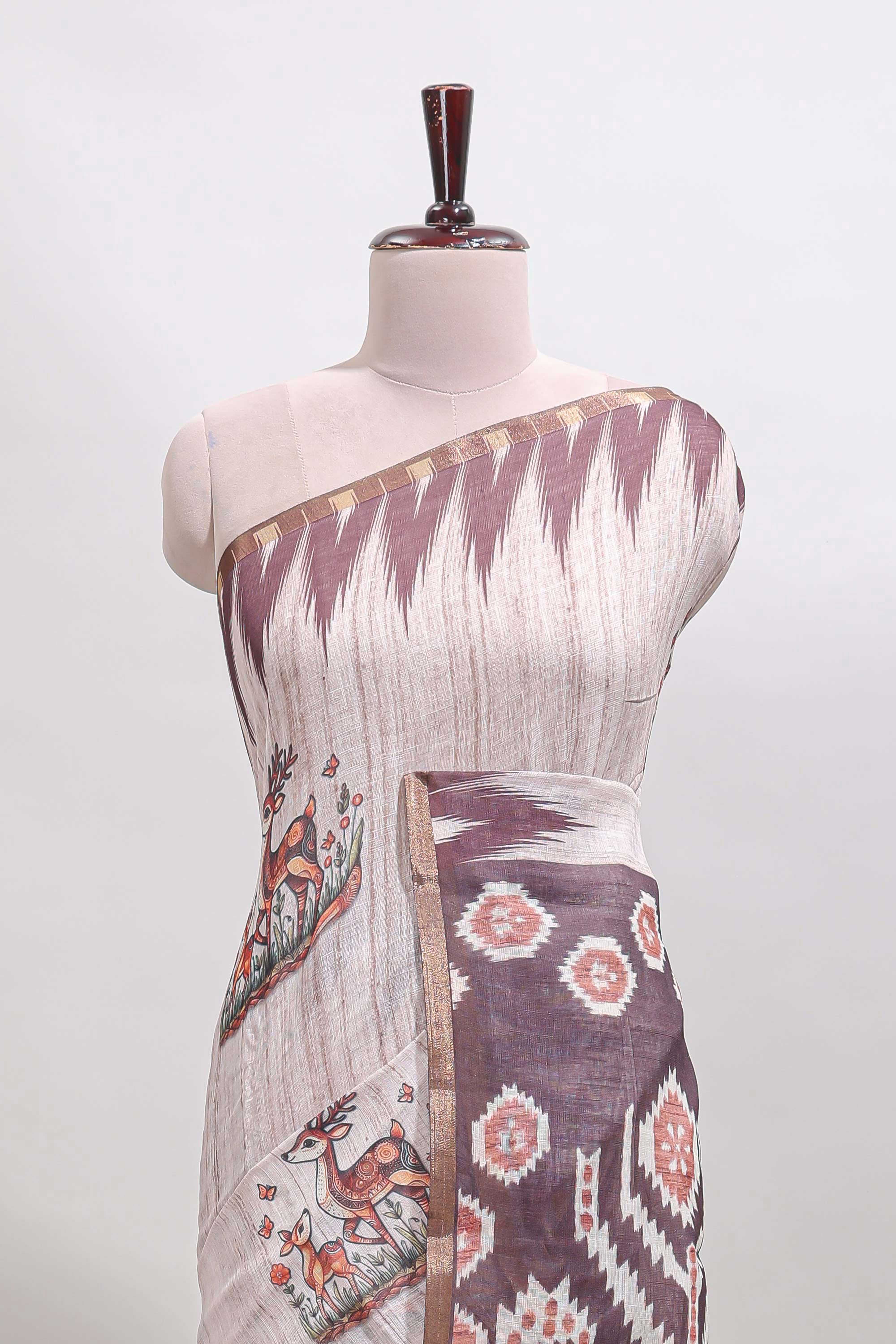 Brown deer & fawn motifs linen cotton saree with self zari border and contrast ikkat style pallu