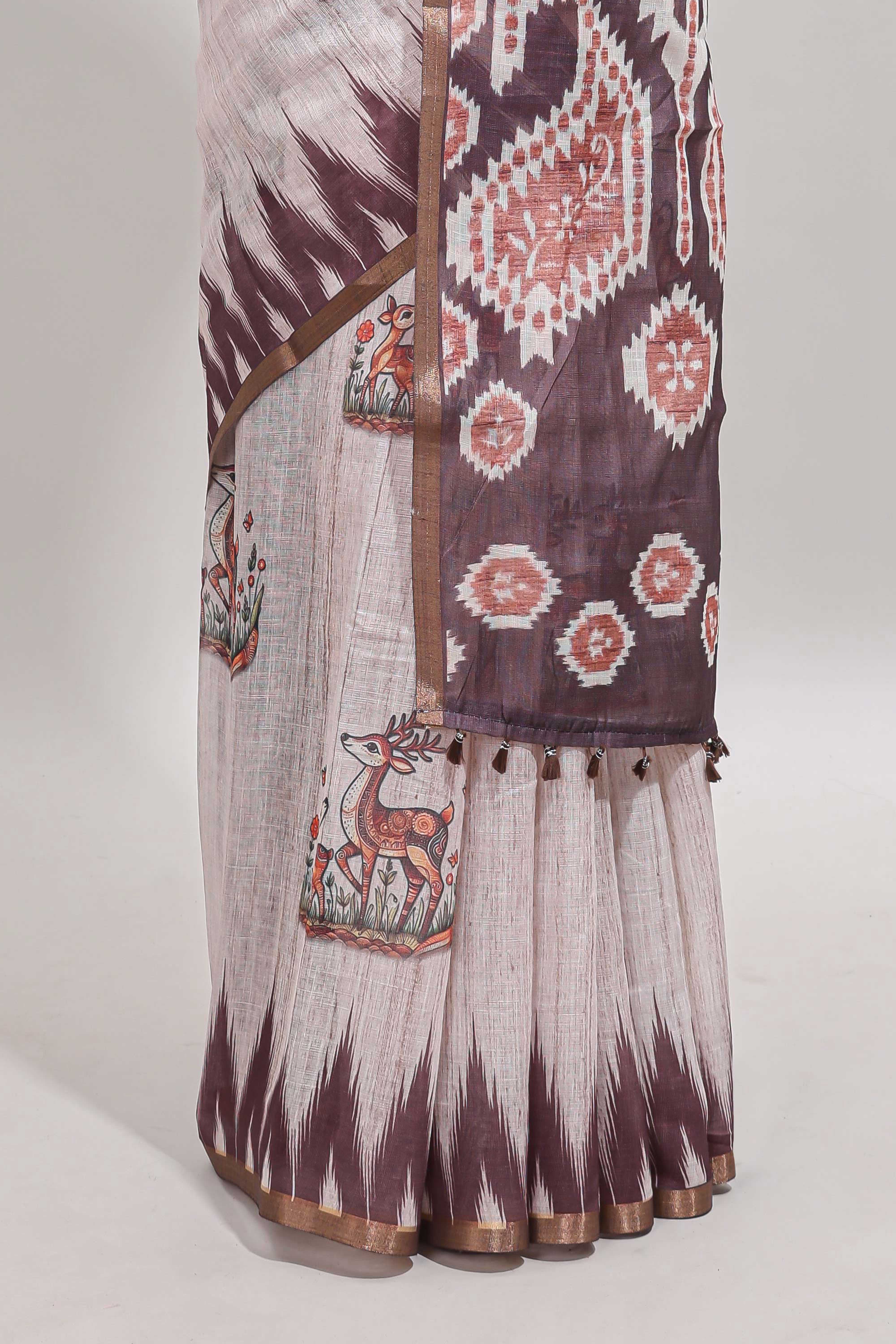 Brown deer & fawn motifs linen cotton saree with self zari border and contrast ikkat style pallu