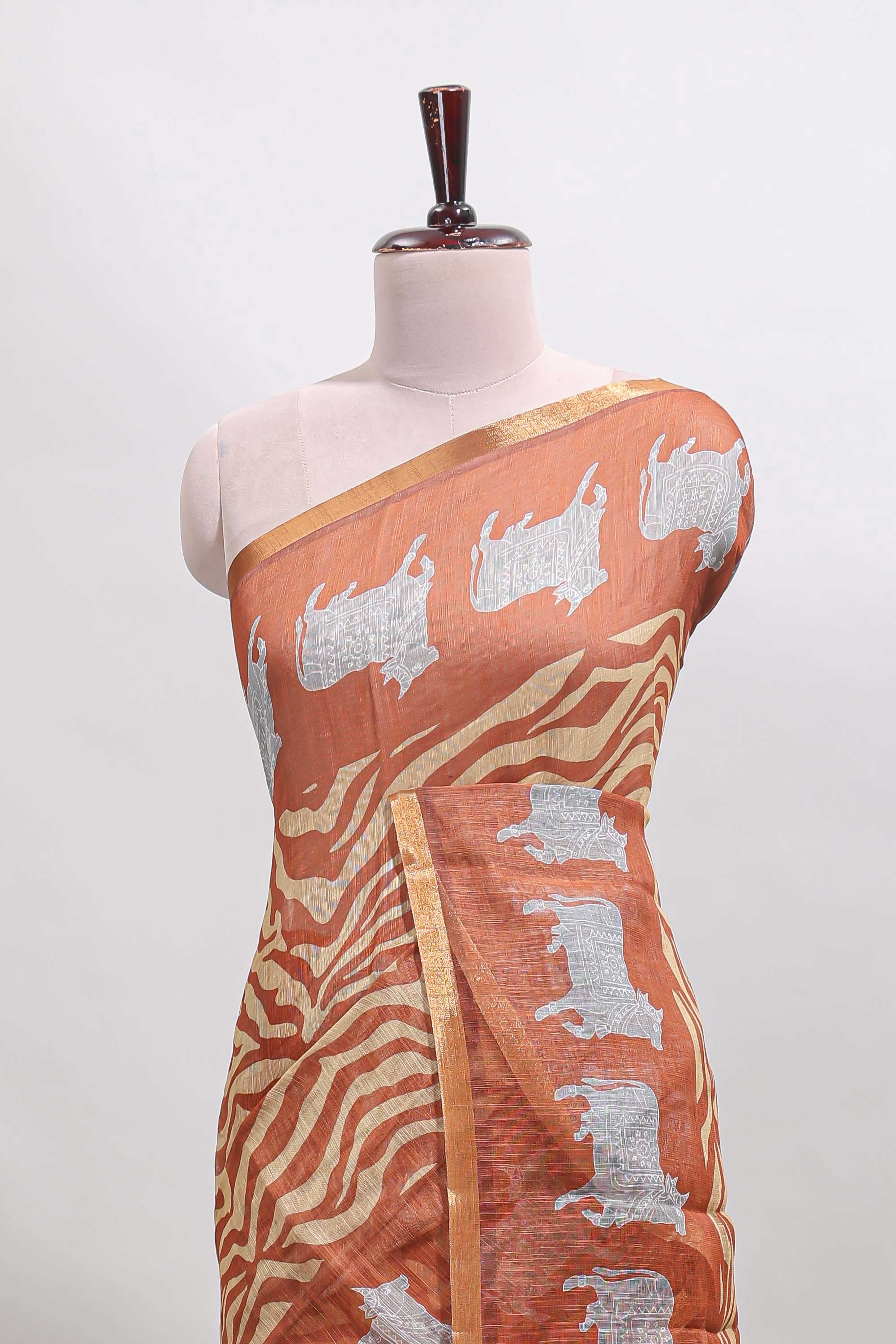 Brown pichwai cow prints & Zebra inspired pattern linen cotton saree with self zari border and matching blouse