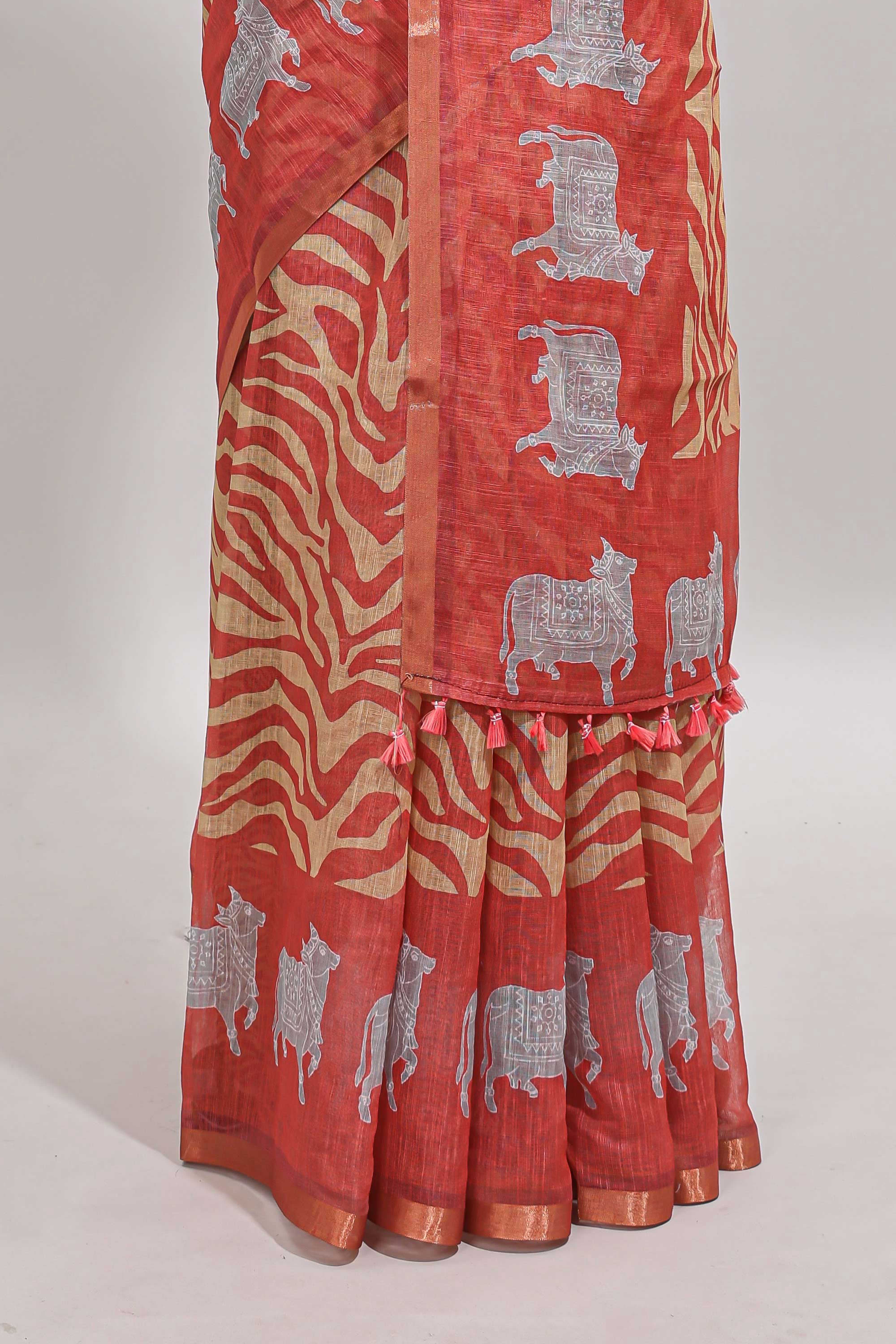 Orange pichwai cow prints & Zebra inspired pattern linen cotton saree with self zari border and matching blouse