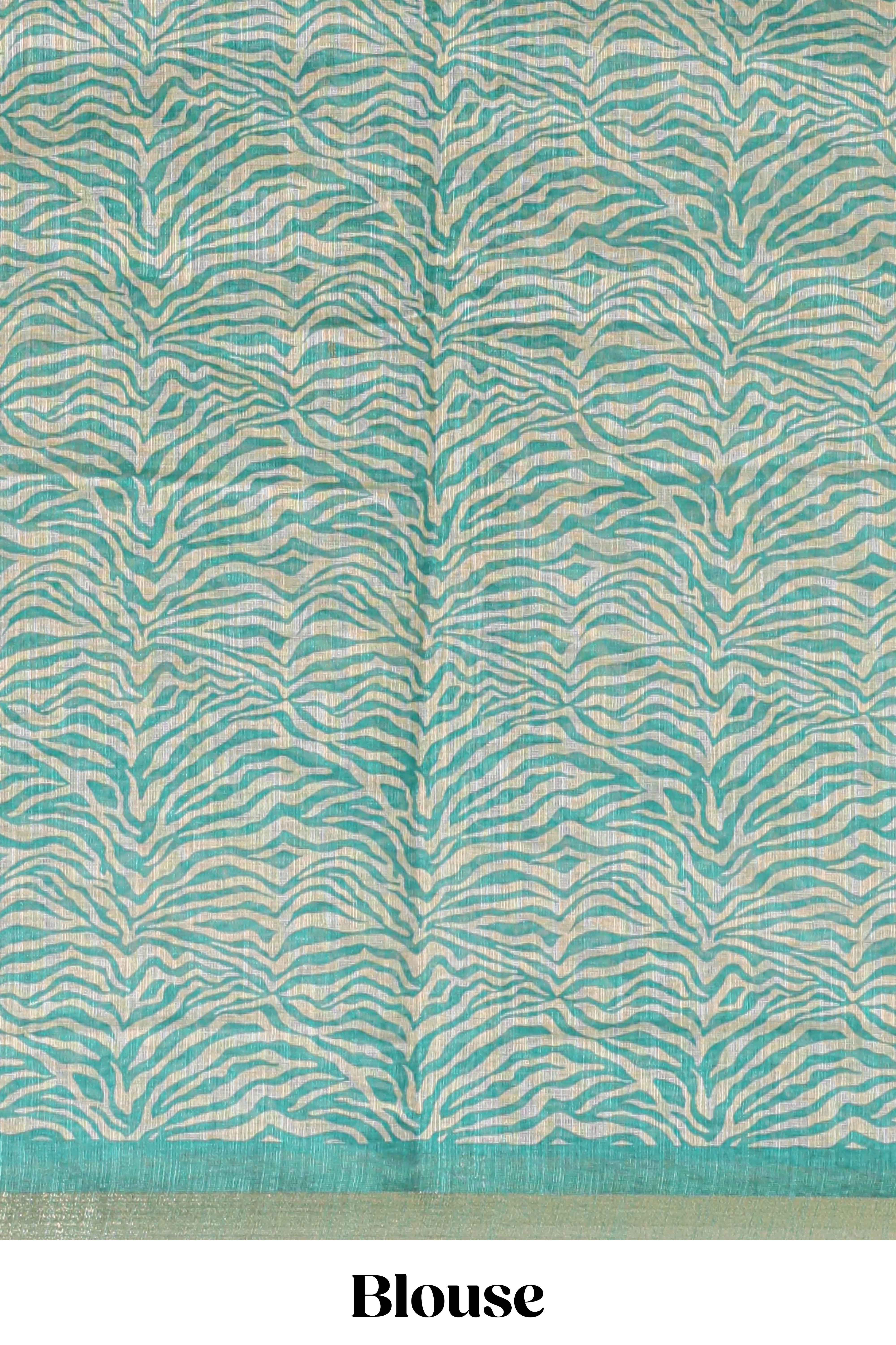 Turquoise green pichwai cow prints & Zebra inspired pattern linen cotton saree with self zari border and matching blouse