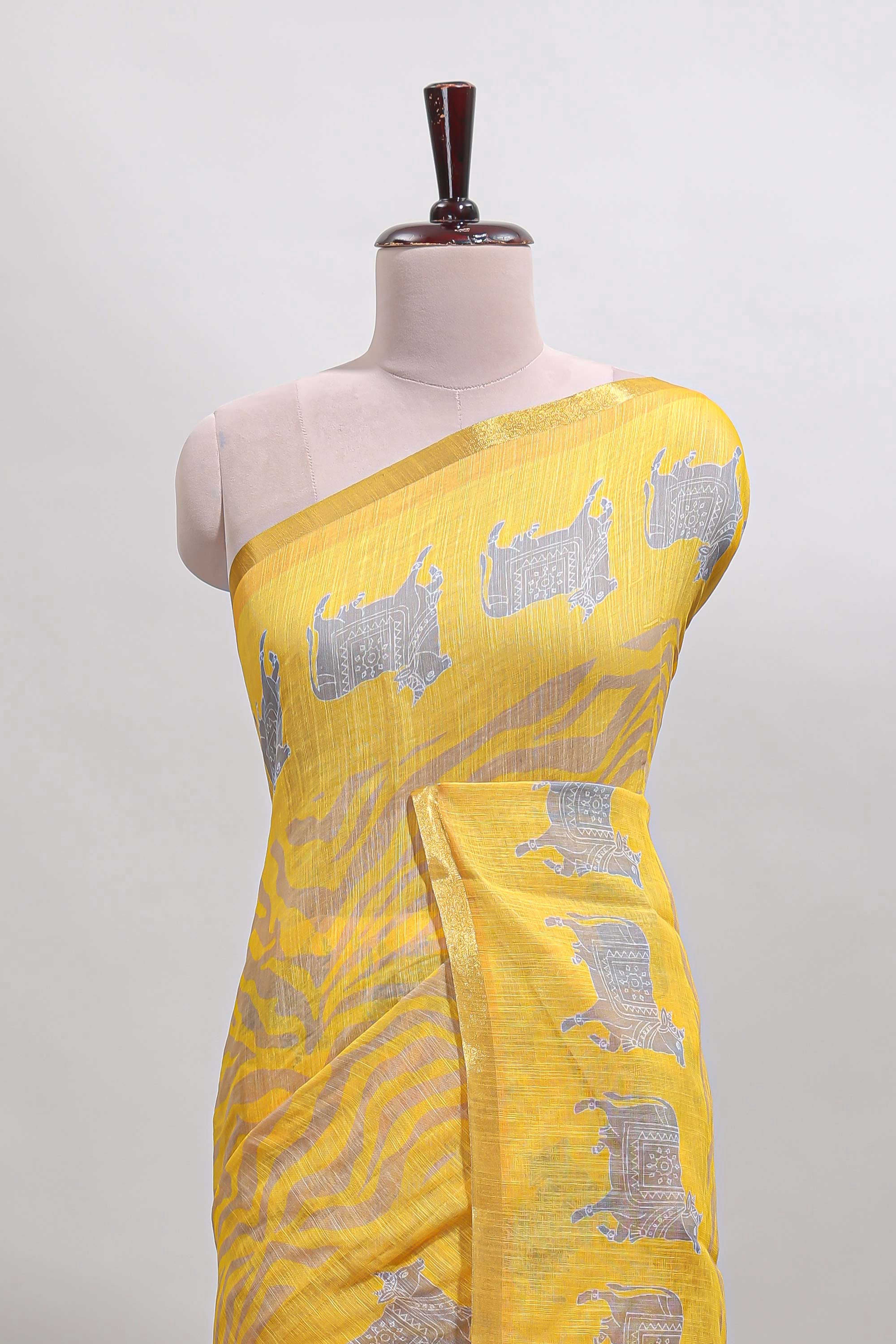 Yellow pichwai cow prints & Zebra inspired pattern linen cotton saree with self zari border and matching blouse