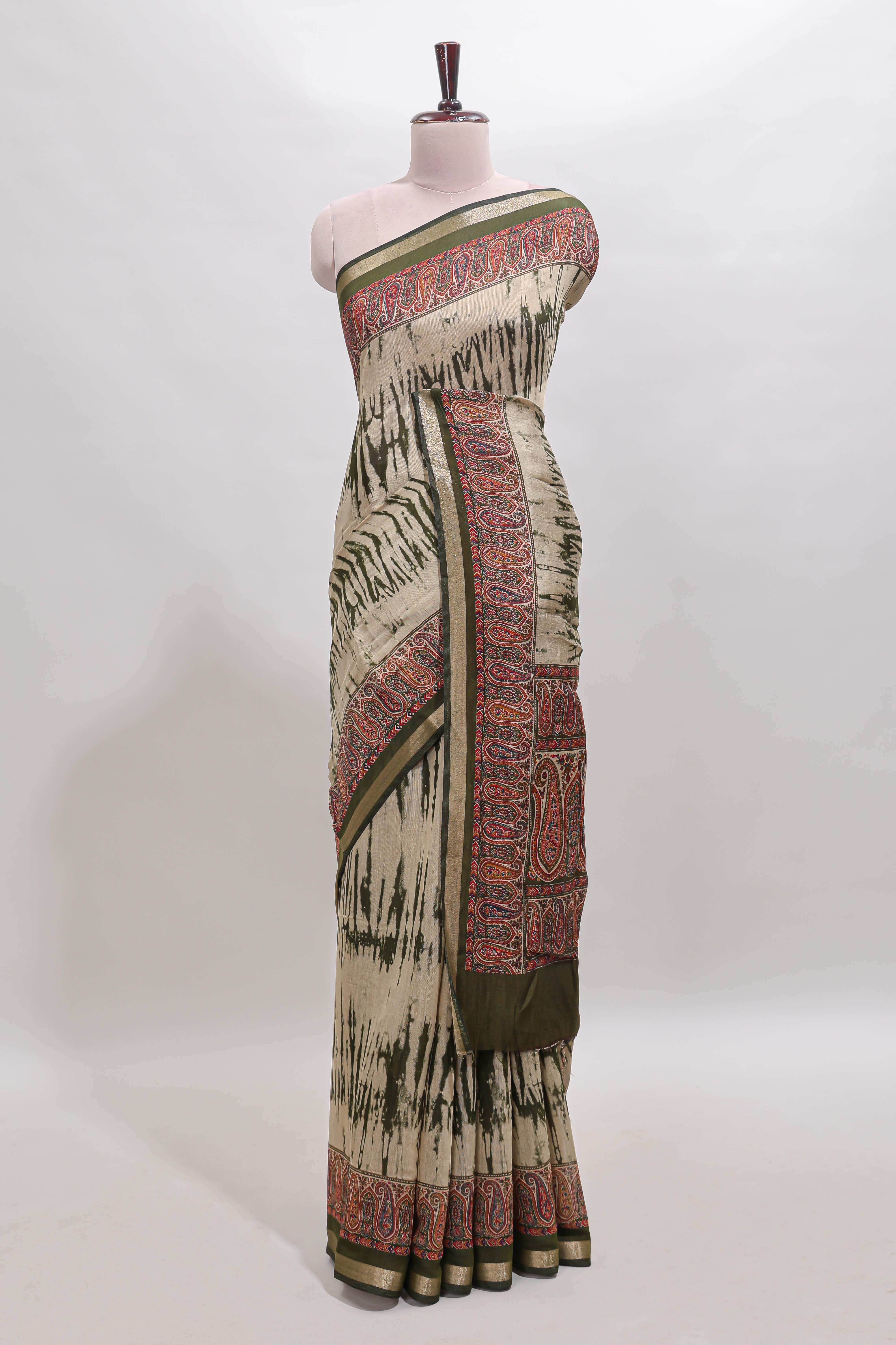 Brown shibori print linen cotton saree with contrast green zari border and printed blouse