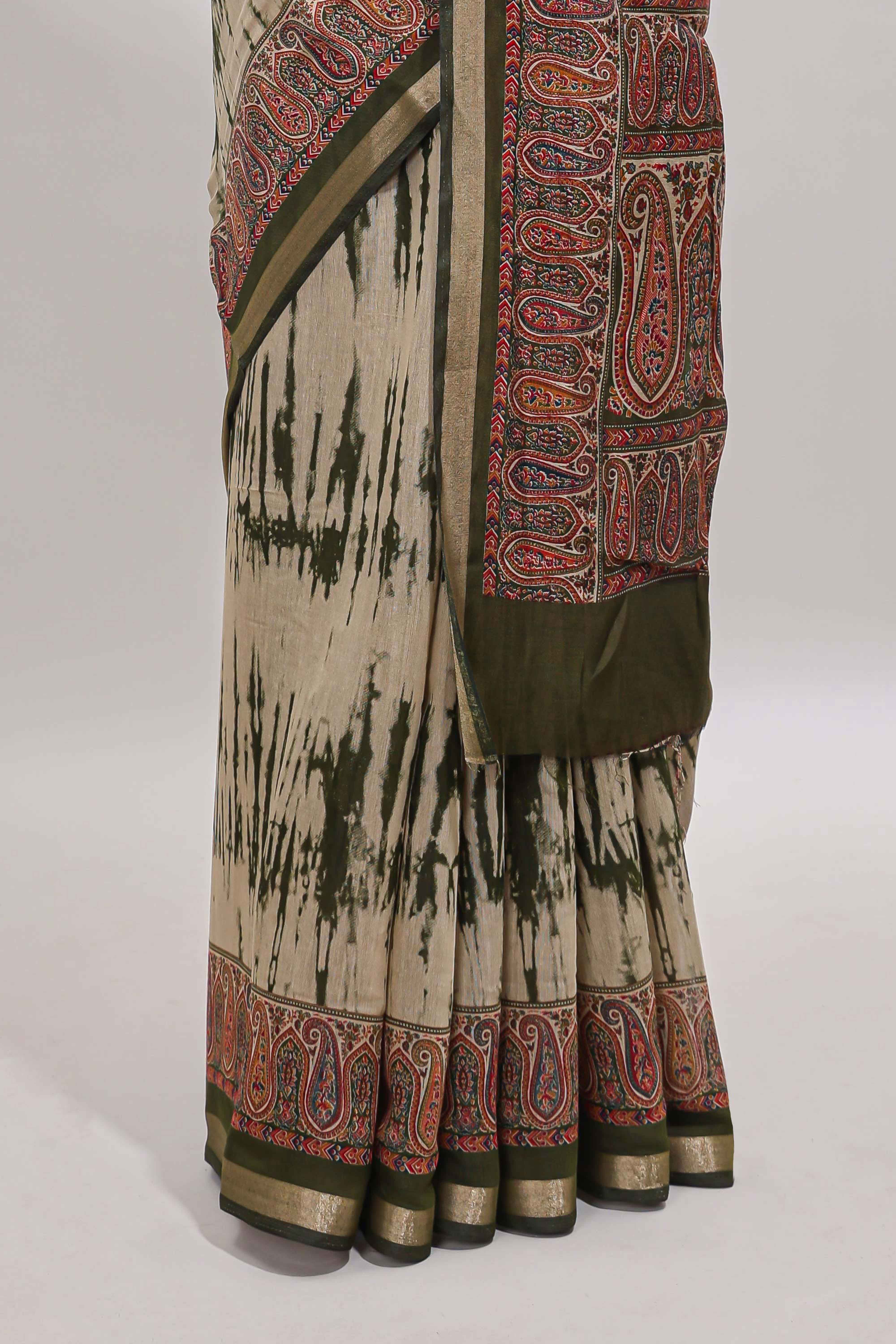 Brown shibori print linen cotton saree with contrast green zari border and printed blouse
