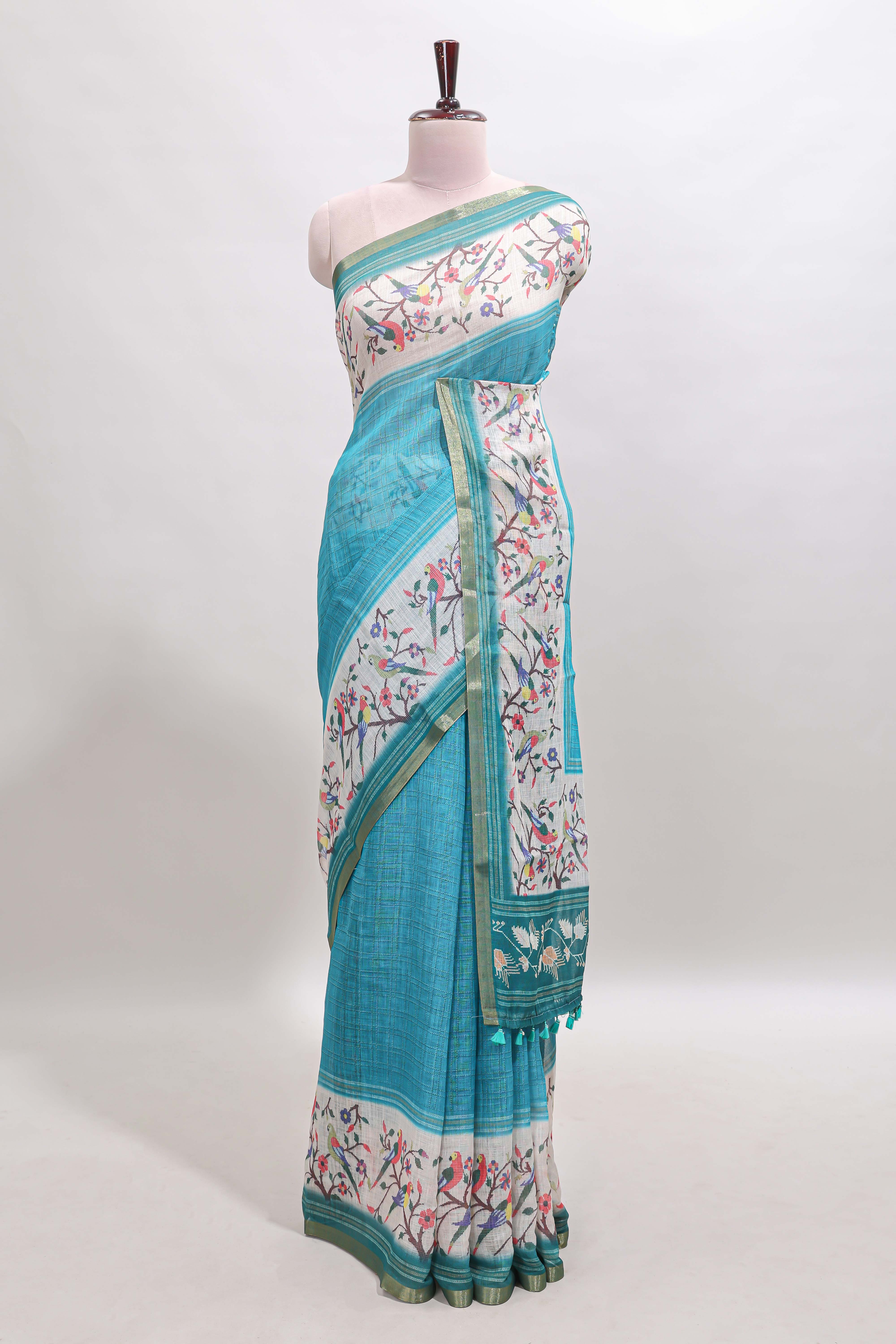 Turquoise green floral & bird motif bottom with checked body linen cotton saree, self zari border and matching blouse
