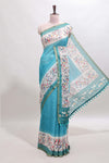 Turquoise green floral & bird motif bottom with checked body linen cotton saree, self zari border and matching blouse