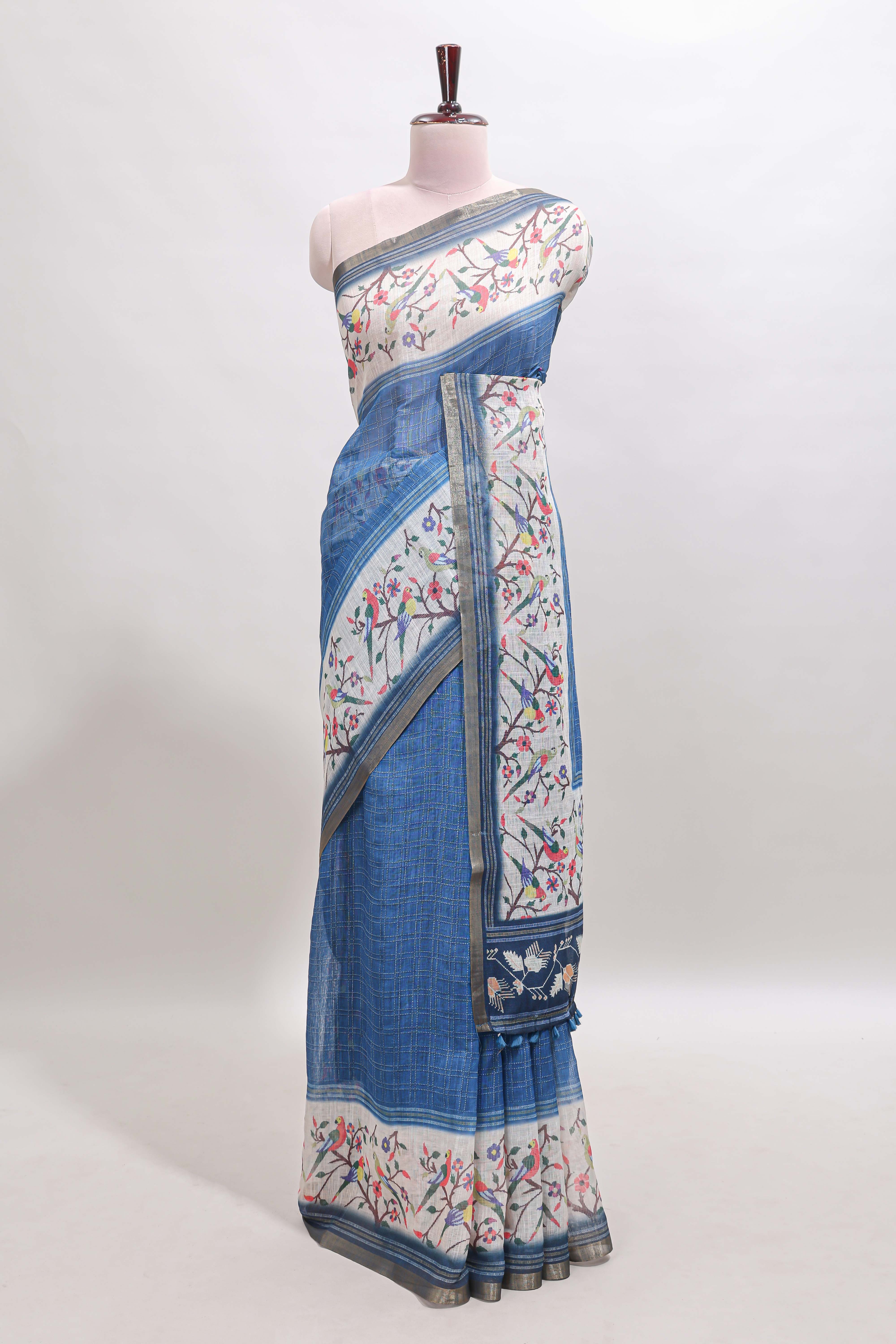 Blue floral & bird motif bottom with checked body linen cotton saree, self zari border and matching blouse