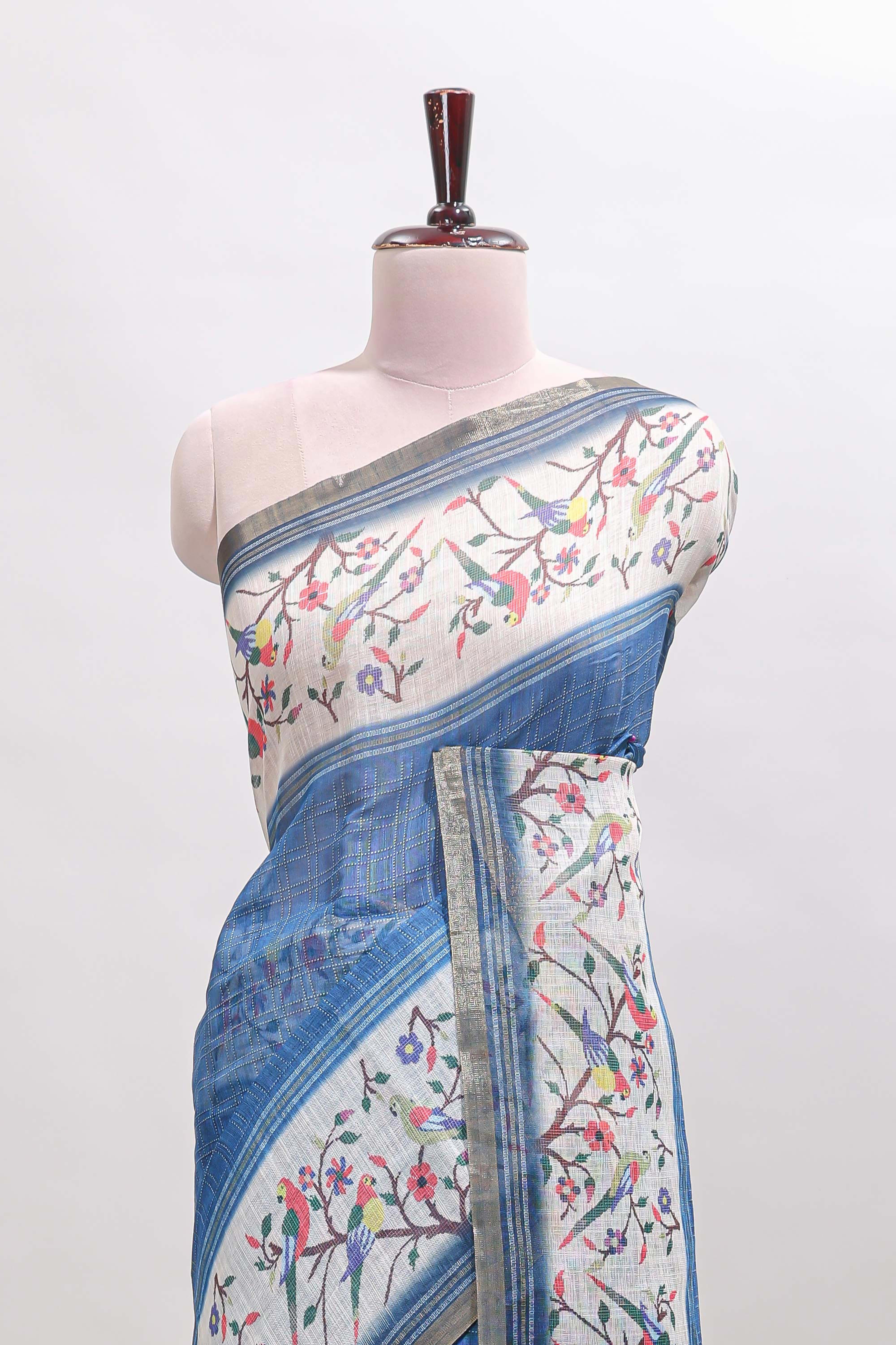 Blue floral & bird motif bottom with checked body linen cotton saree, self zari border and matching blouse